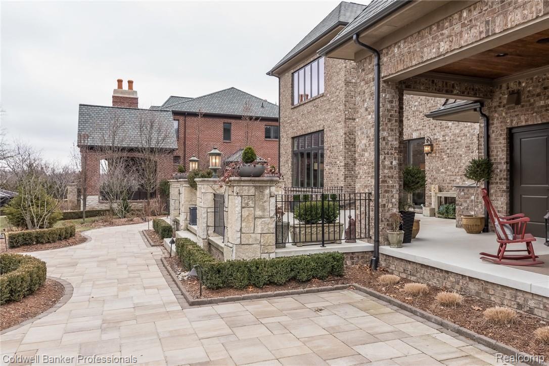 3762 Thatcher Drive Rochester, MI 48309 - Photo 55 of 76 Extensive pavers and stone work, lanai, outdoor fireplace, hot tub and grill. Extensive outdoor lighting for stunning view and added security.