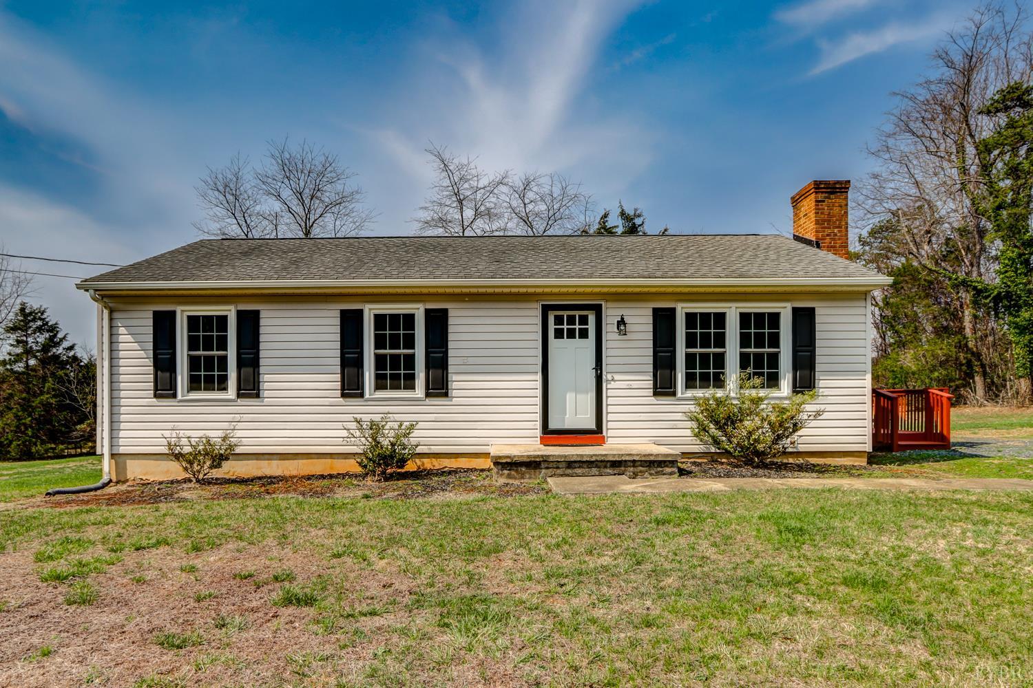 a front view of a house with yard