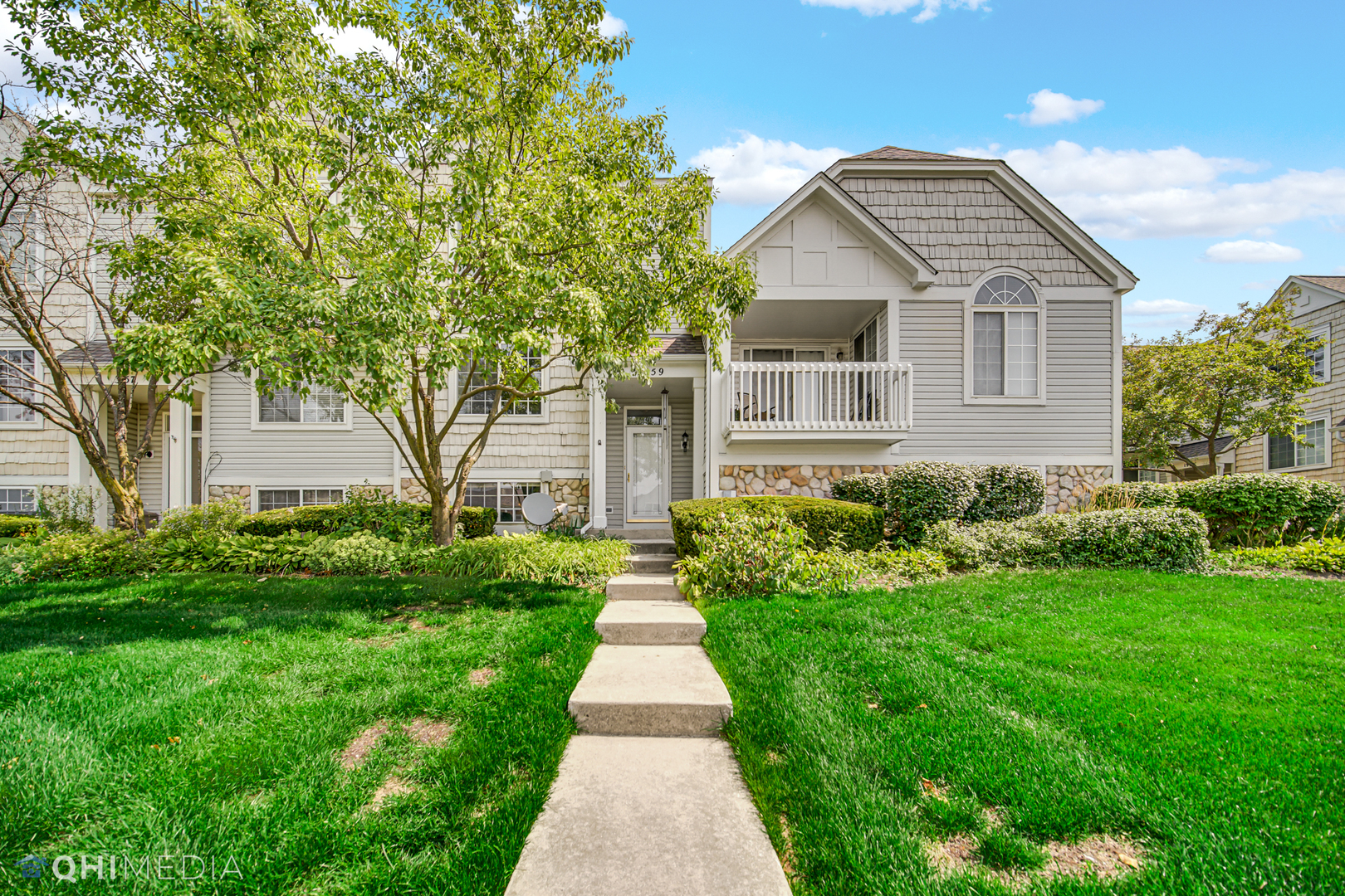 3159 Teal Bay Court Aurora, IL 60503 - Photo 1 of 22 a front view of a house with a garden