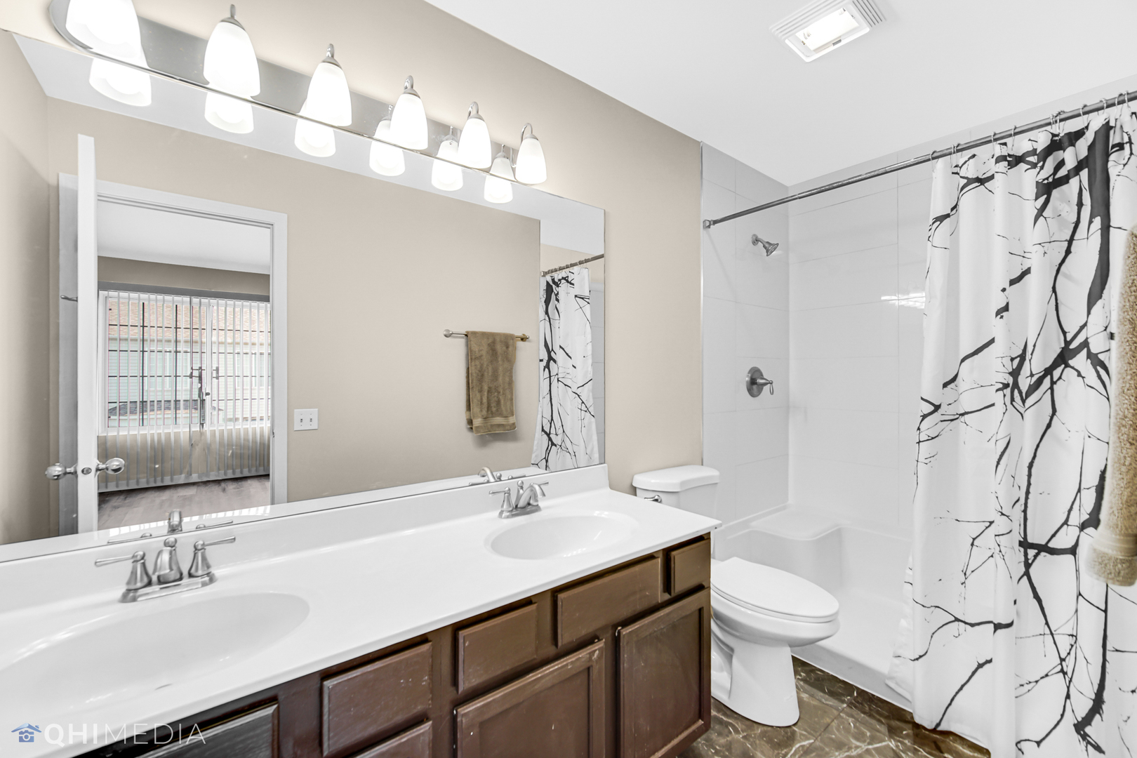 3159 Teal Bay Court Aurora, IL 60503 - Photo 15 of 22 a bathroom with a sink toilet a mirror a vanity and shower