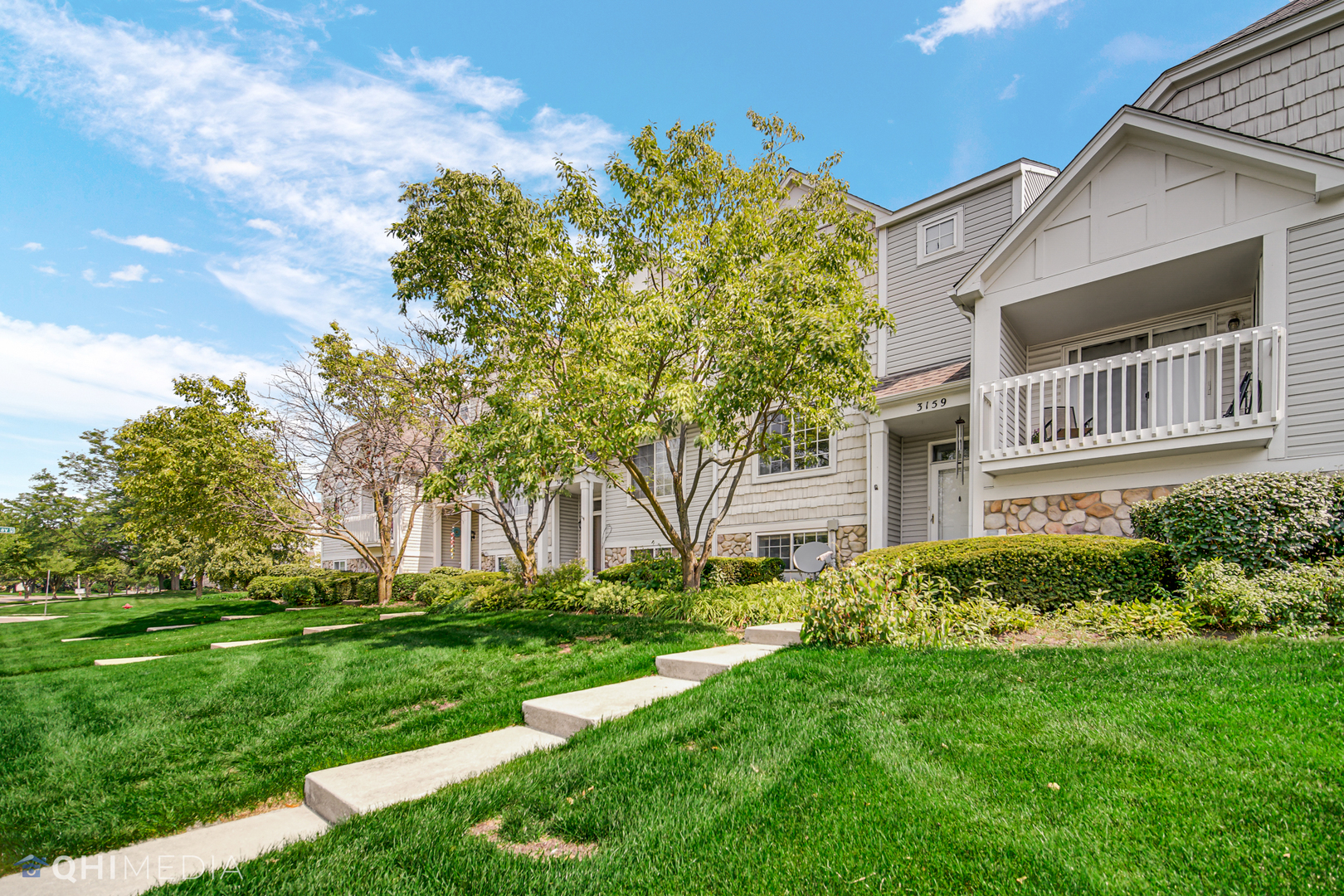 3159 Teal Bay Court Aurora, IL 60503 - Photo 2 of 22 a front view of a house with garden