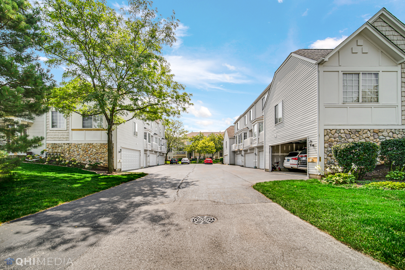 3159 Teal Bay Court Aurora, IL 60503 - Photo 22 of 22 a front view of a house with a garden and trees