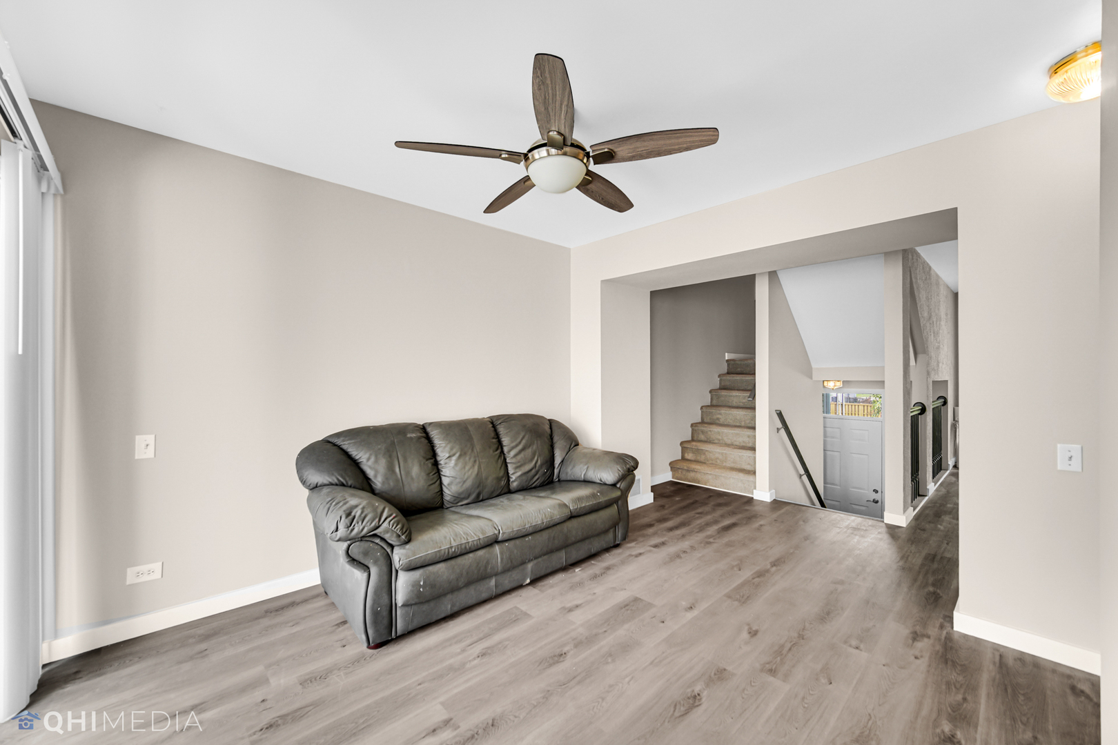 3159 Teal Bay Court Aurora, IL 60503 - Photo 7 of 22 a living room with furniture and a wooden floor