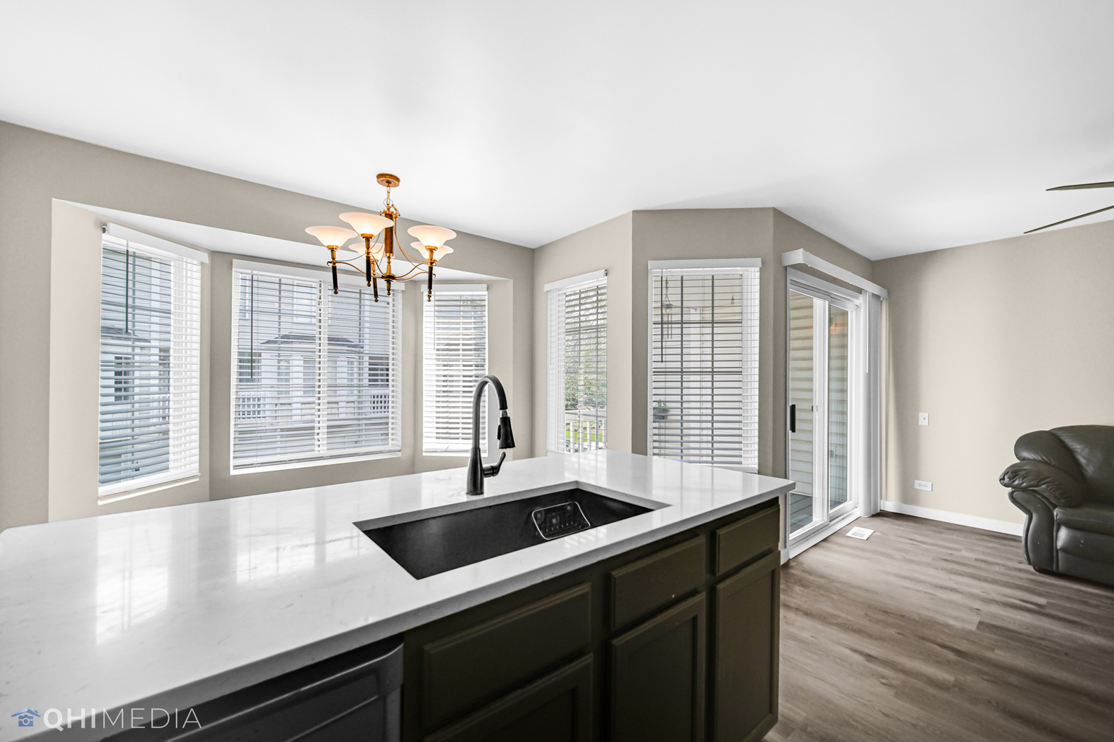 3159 Teal Bay Court Aurora, IL 60503 - Photo 10 of 22 a kitchen with a sink cabinets and wooden floor