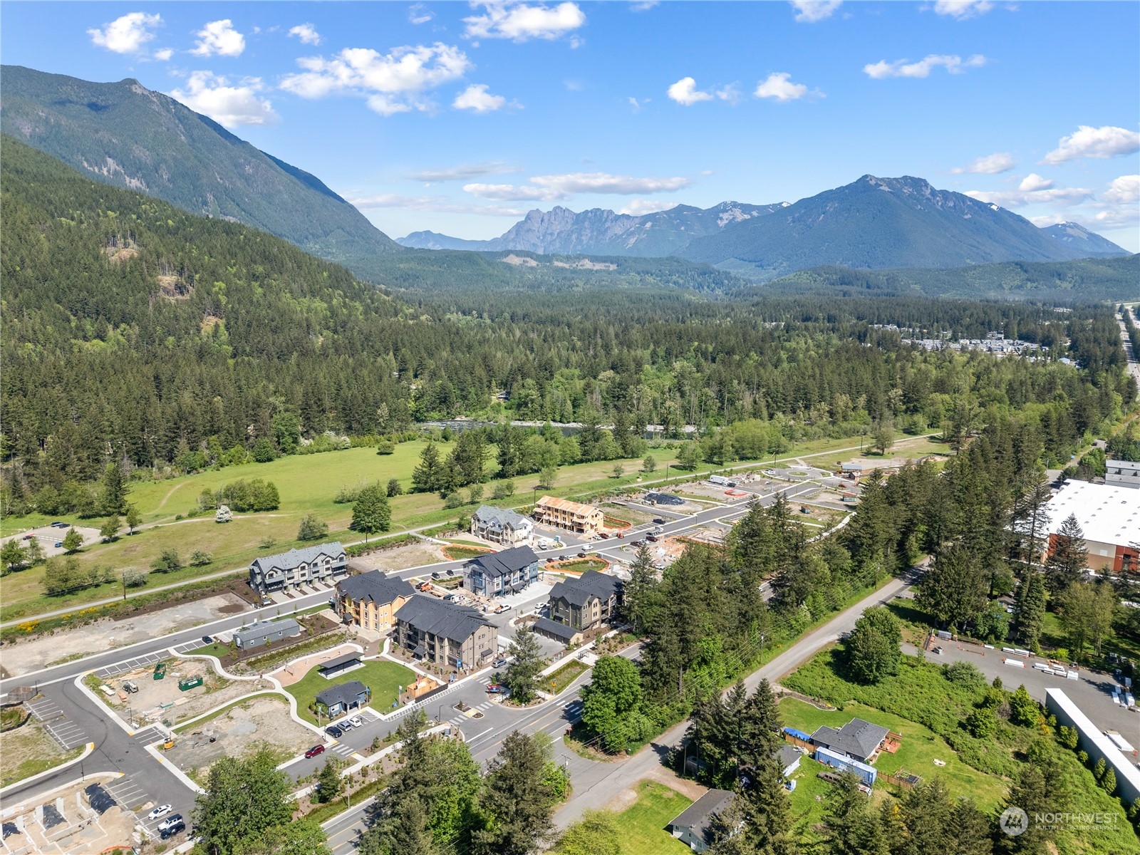 1237 Meander Way Southeast, Unit 101 North Bend, WA 98045 - Photo 13 of 13 a view of a lush green hillside and houses