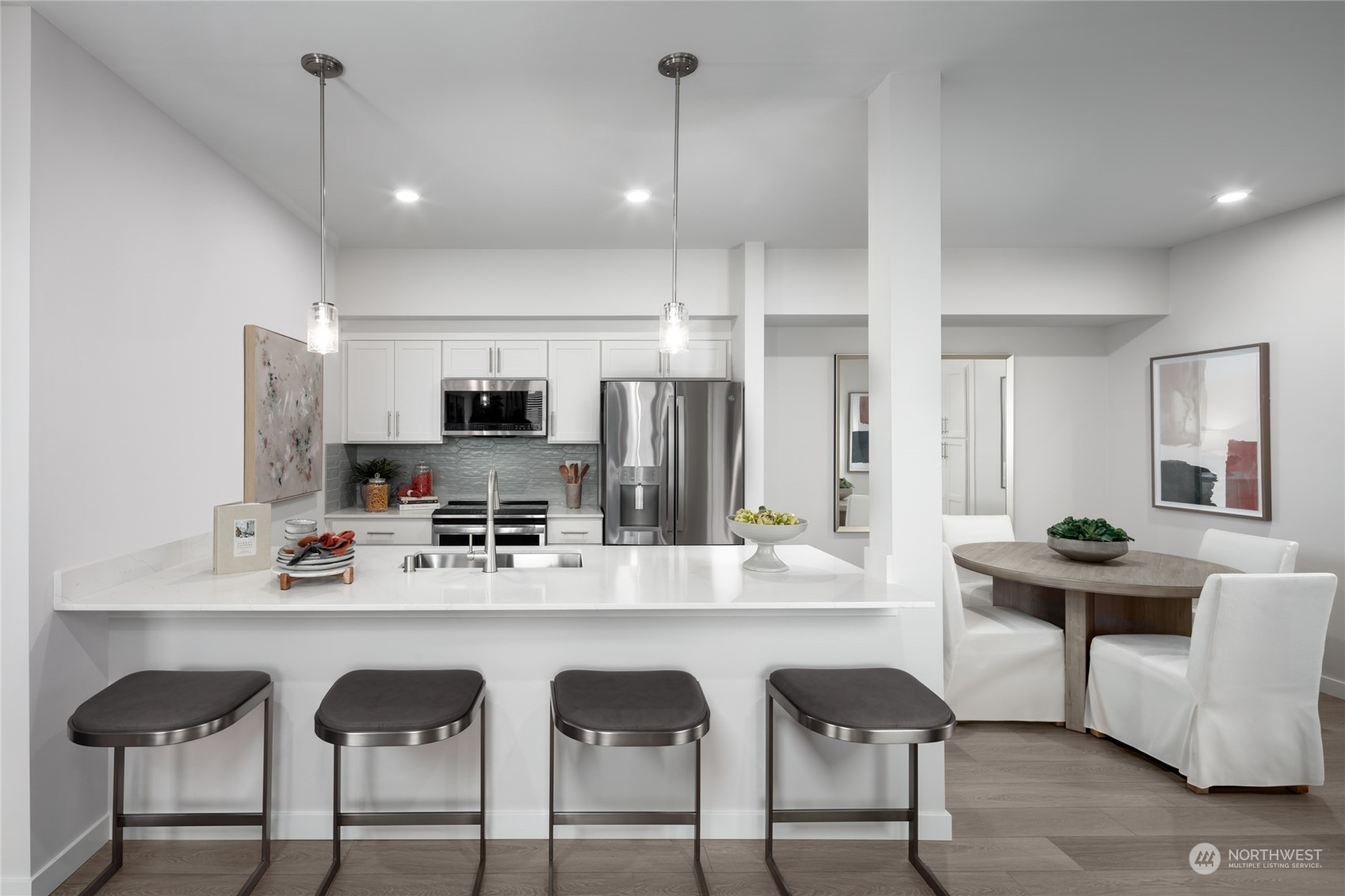 1237 Meander Way Southeast, Unit 101 North Bend, WA 98045 - Photo 3 of 13 a kitchen with granite countertop a sink cabinets and window
