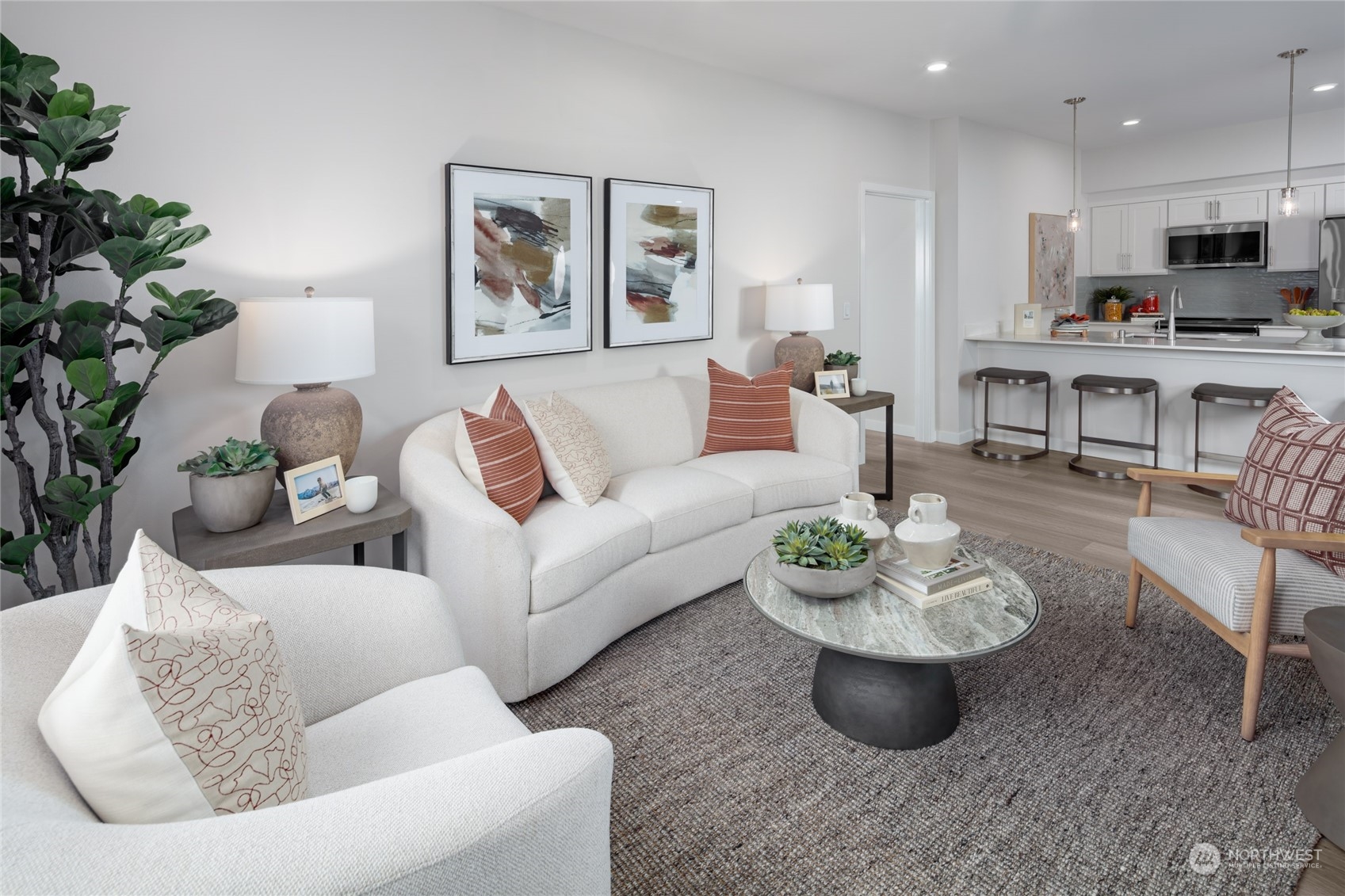 1237 Meander Way Southeast, Unit 101 North Bend, WA 98045 - Photo 6 of 13 a living room with furniture and a potted plant
