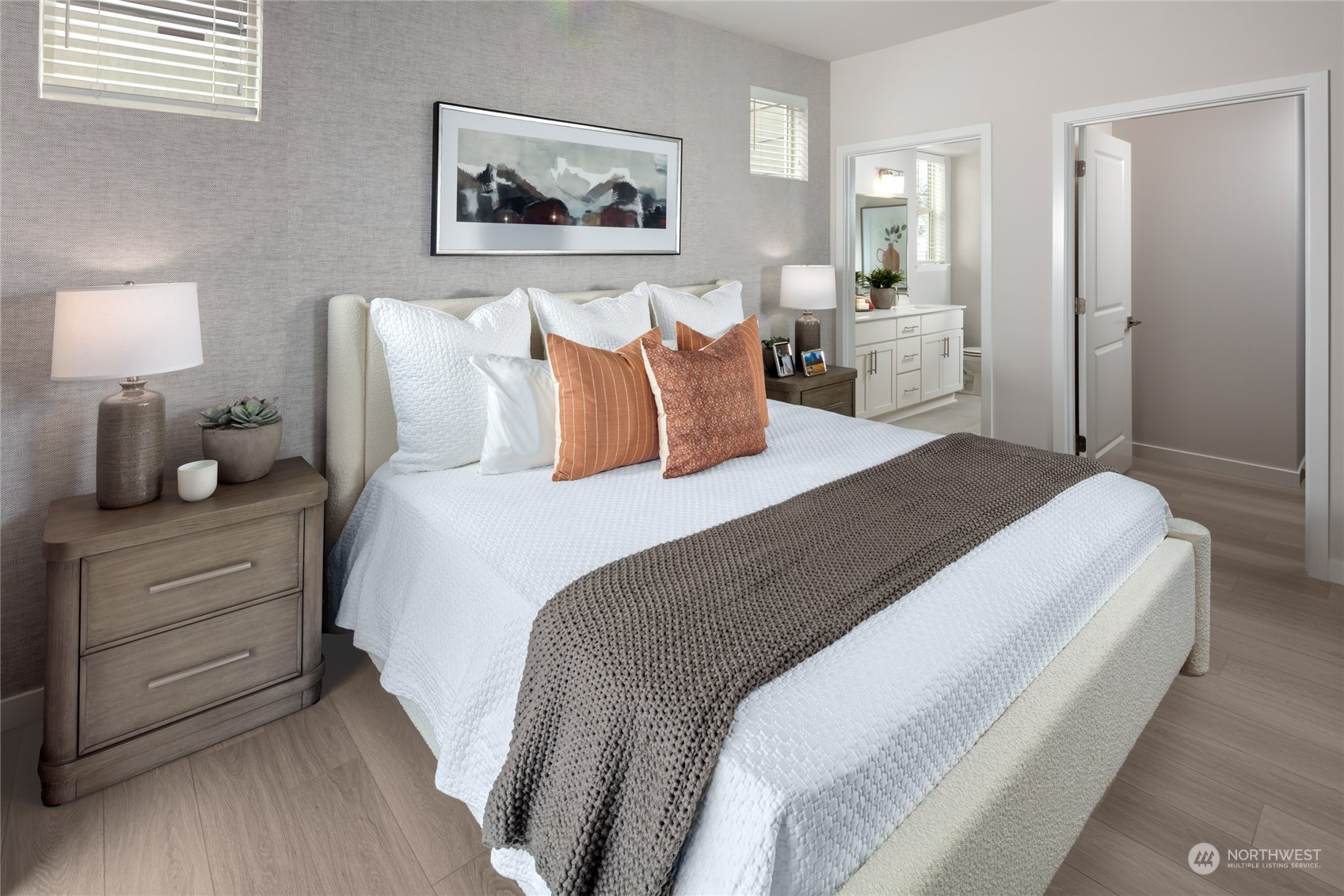 1237 Meander Way Southeast, Unit 101 North Bend, WA 98045 - Photo 7 of 13 a bedroom with bed and painting on the wall