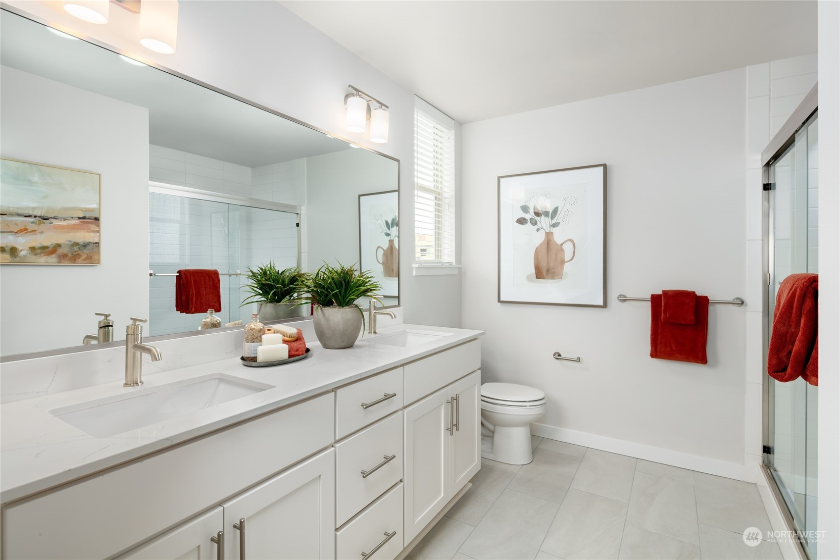 1237 Meander Way Southeast, Unit 101 North Bend, WA 98045 - Photo 8 of 13 a bathroom with a double vanity sink mirror and toilet