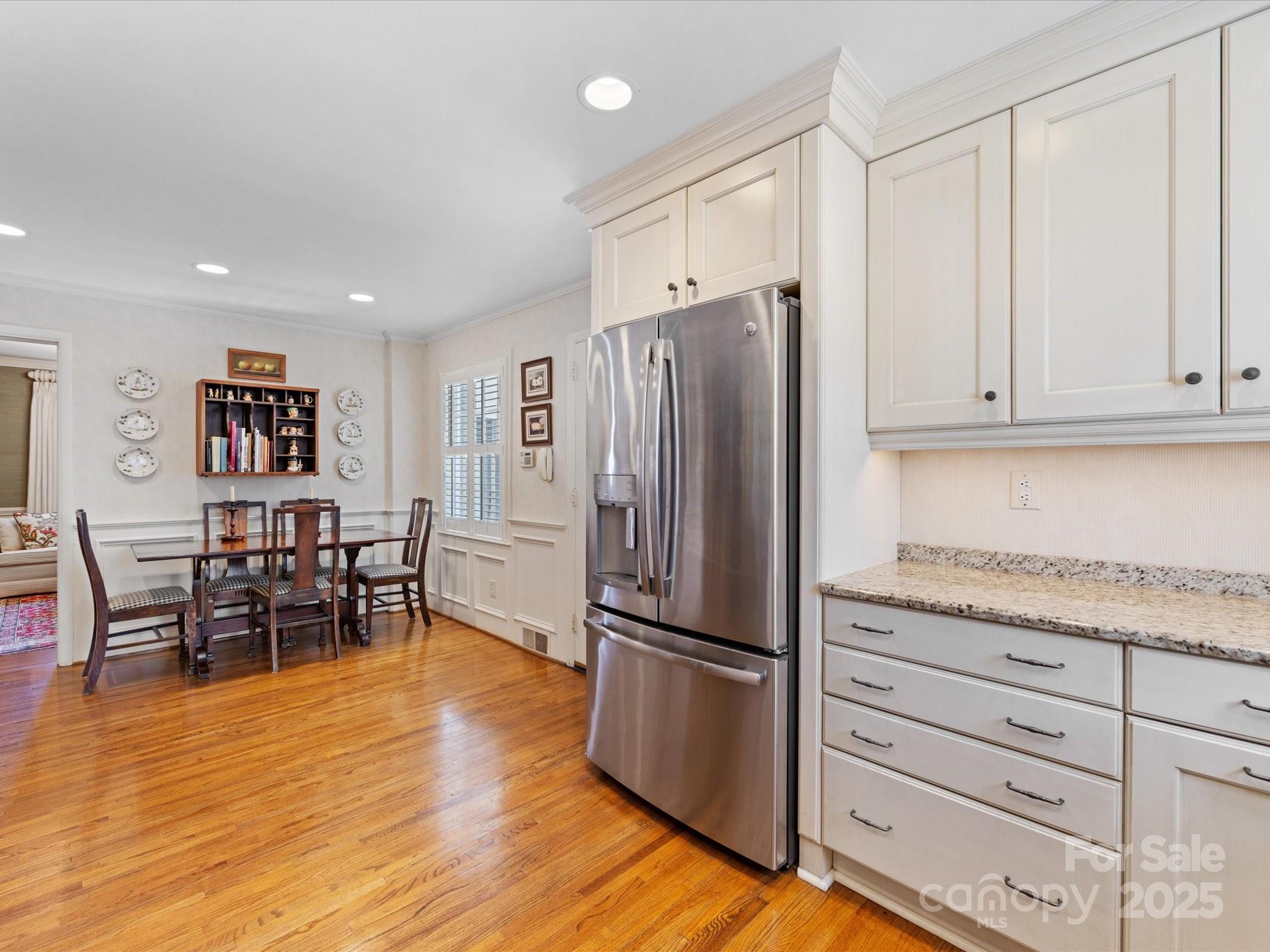 555 Manning Drive, Unit 7 Charlotte, NC 28209 - Photo 14 of 45 a kitchen with granite countertop cabinets and stainless steel appliances