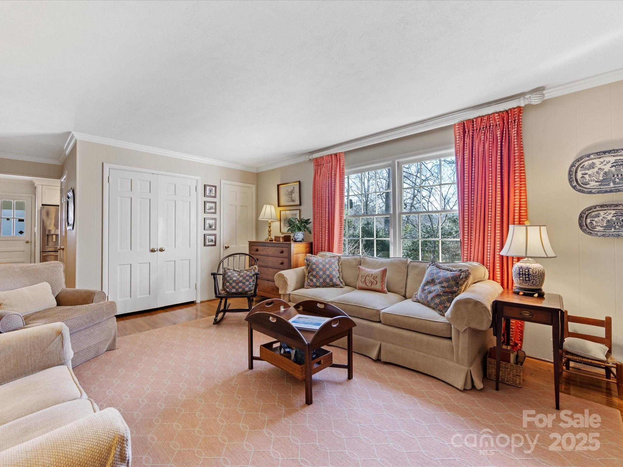 555 Manning Drive, Unit 7 Charlotte, NC 28209 - Photo 15 of 45 a living room with furniture and a large window