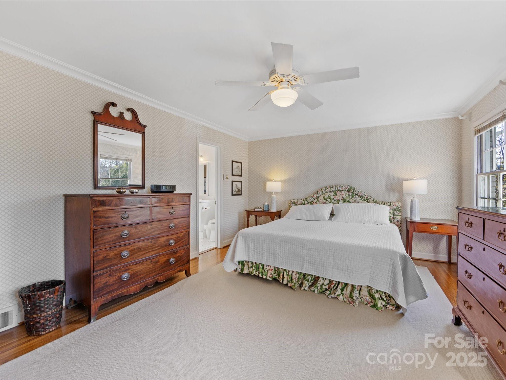 555 Manning Drive, Unit 7 Charlotte, NC 28209 - Photo 21 of 45 a spacious bedroom with a bed and a dresser
