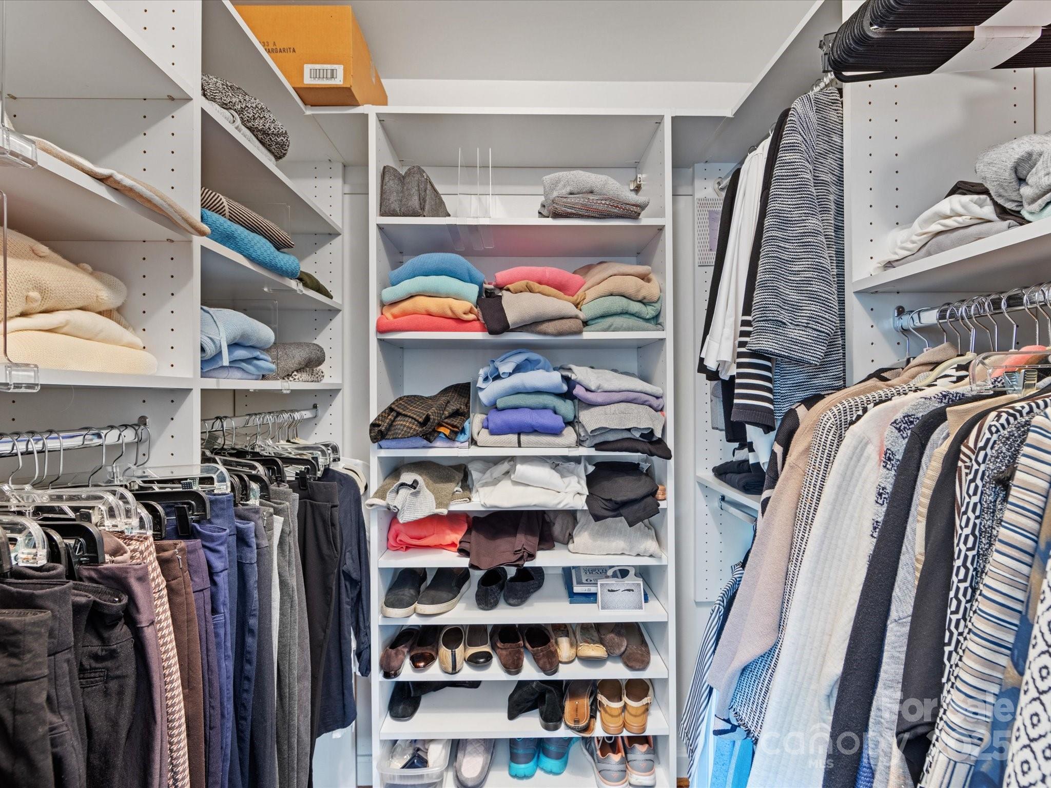555 Manning Drive, Unit 7 Charlotte, NC 28209 - Photo 22 of 45 a view of walk in closet with clothes and shoes