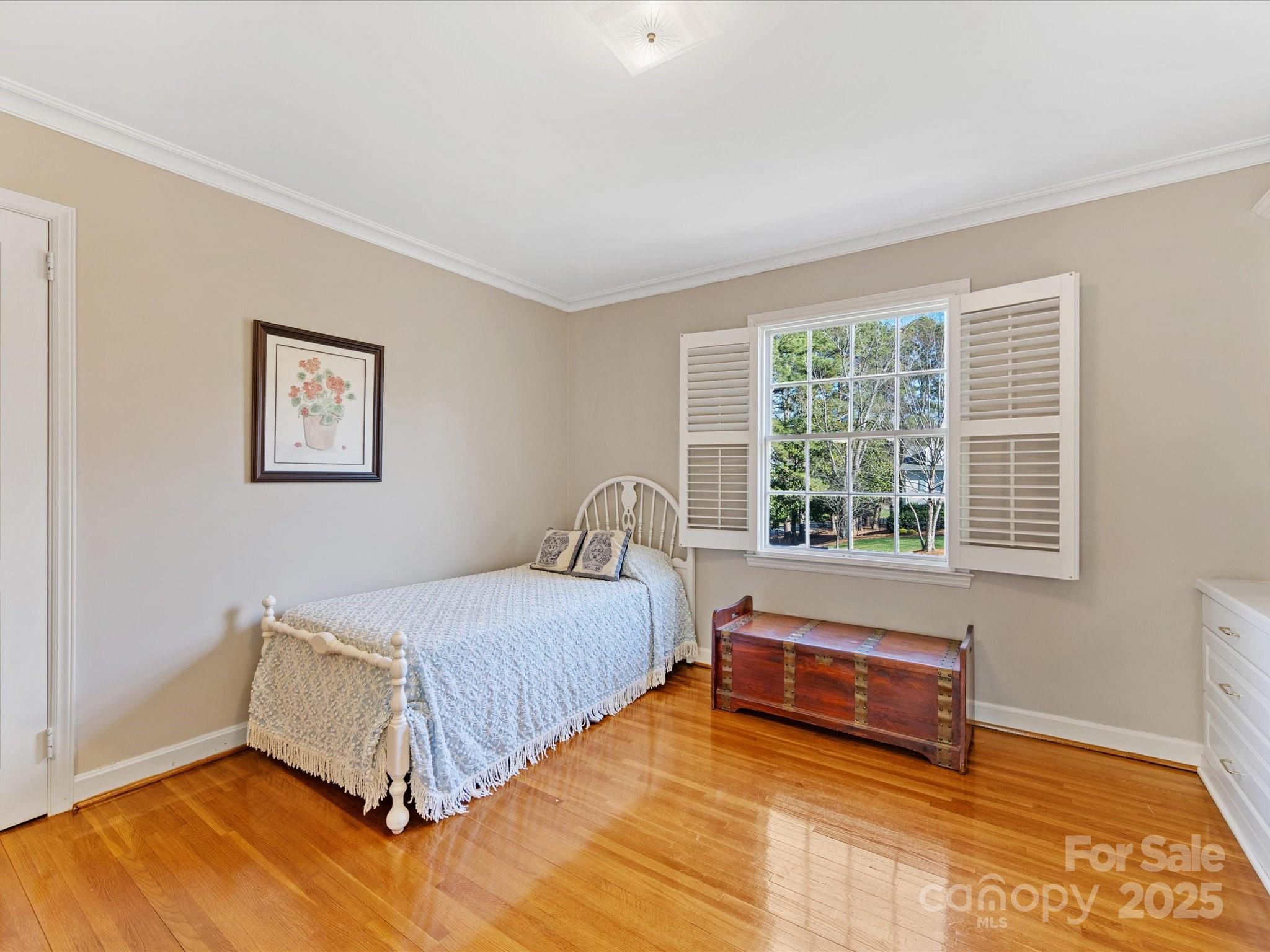 555 Manning Drive, Unit 7 Charlotte, NC 28209 - Photo 28 of 45 a bedroom with a bed and a window
