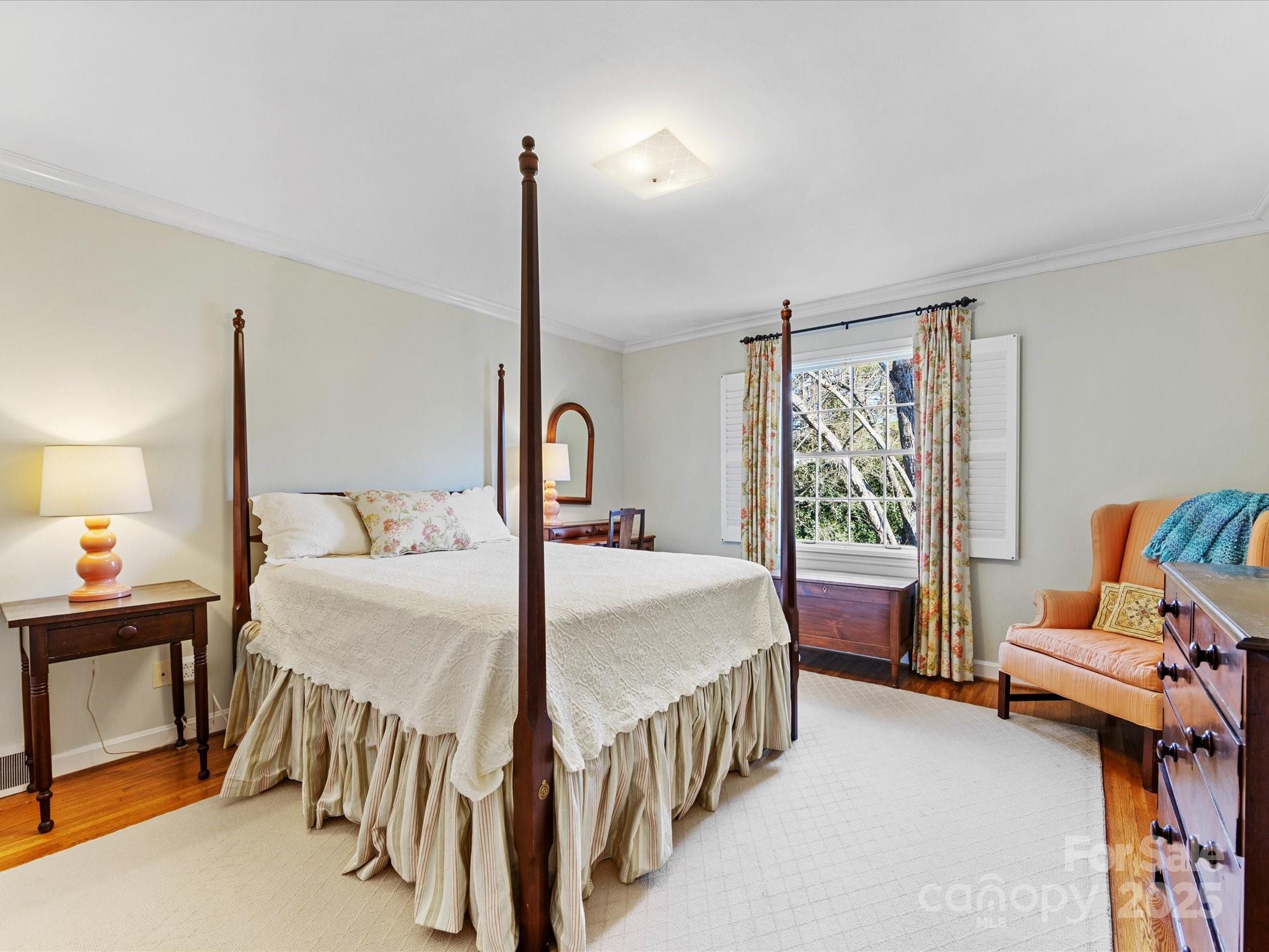 555 Manning Drive, Unit 7 Charlotte, NC 28209 - Photo 29 of 45 a bedroom with a bed and a window