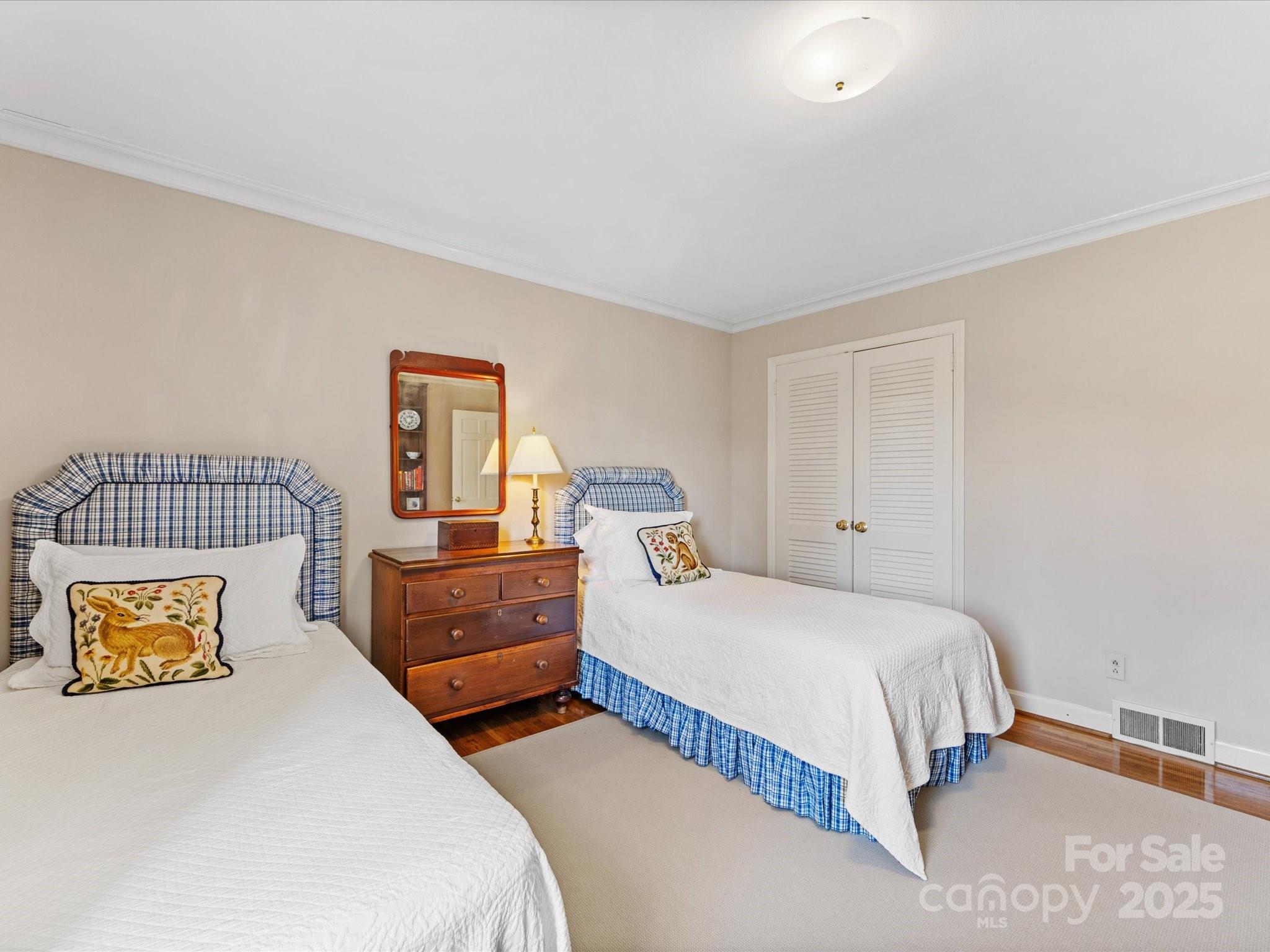 555 Manning Drive, Unit 7 Charlotte, NC 28209 - Photo 34 of 45 a bedroom with a bed and window