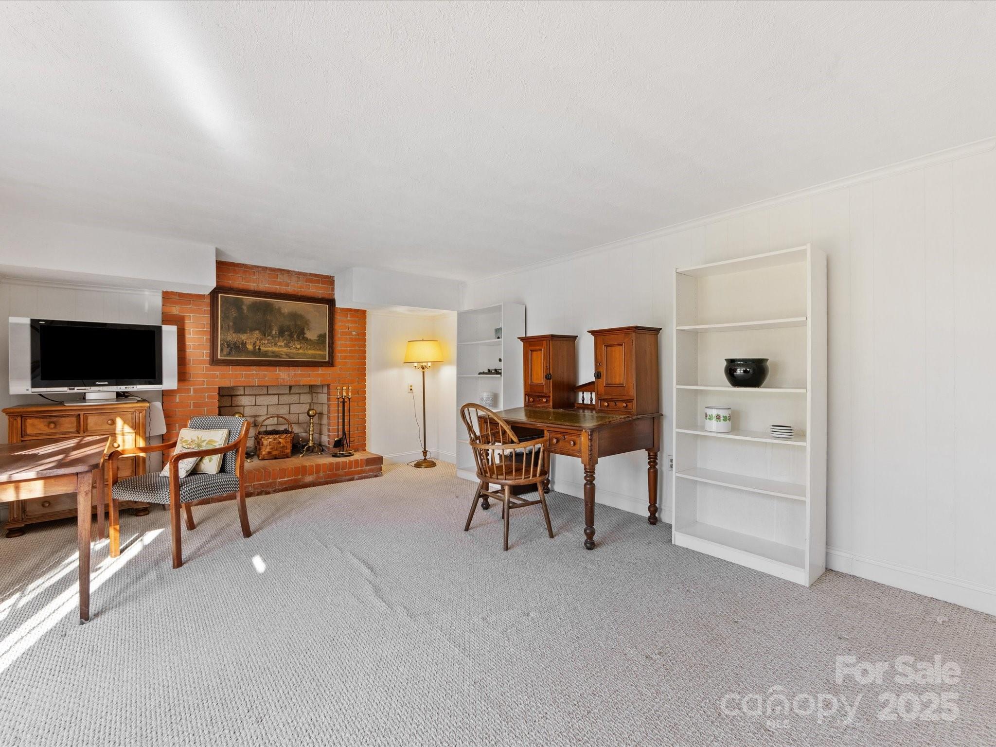 555 Manning Drive, Unit 7 Charlotte, NC 28209 - Photo 35 of 45 a living room with furniture and a flat screen tv