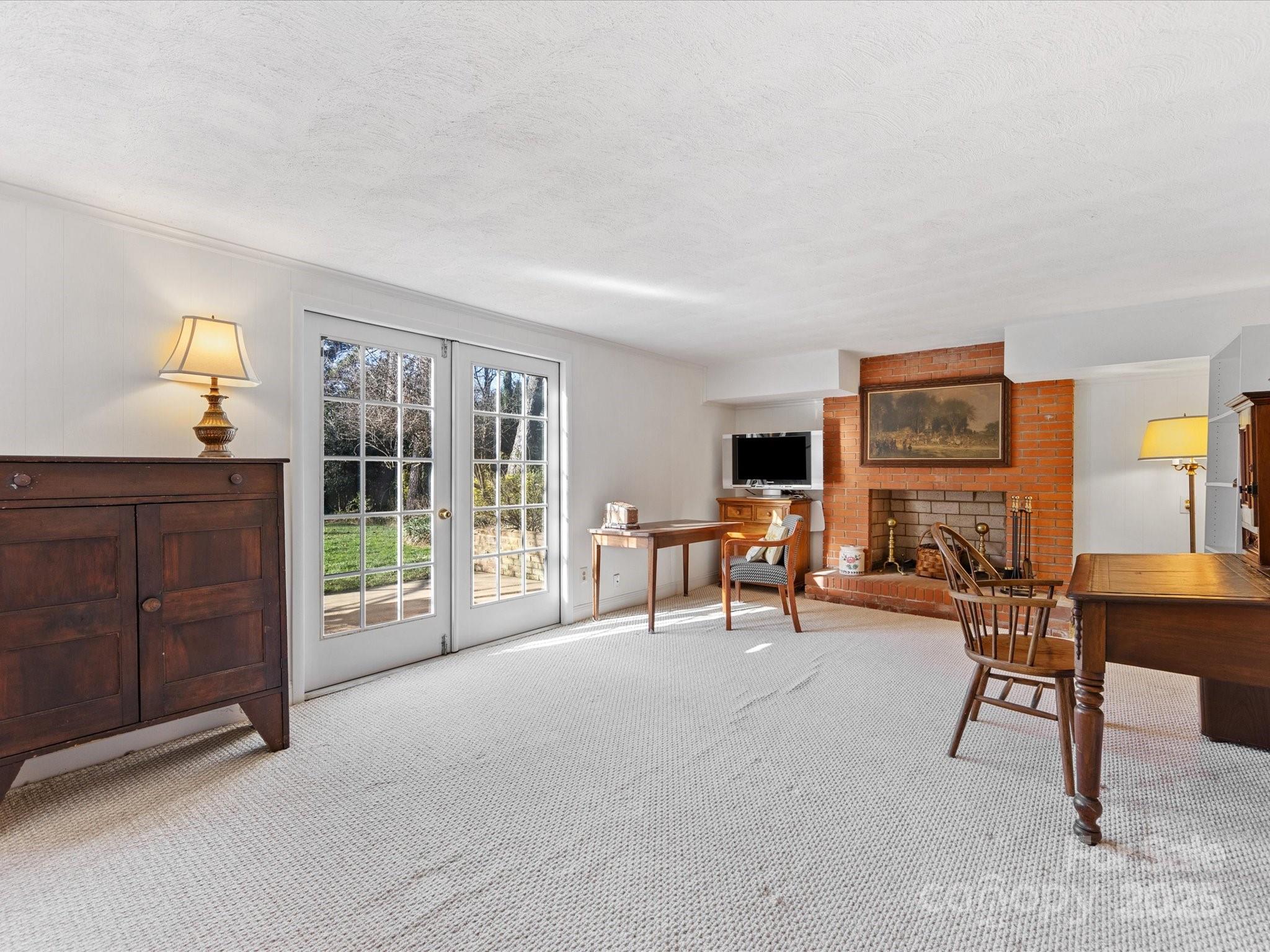 555 Manning Drive, Unit 7 Charlotte, NC 28209 - Photo 36 of 45 a view of a livingroom with furniture and a window
