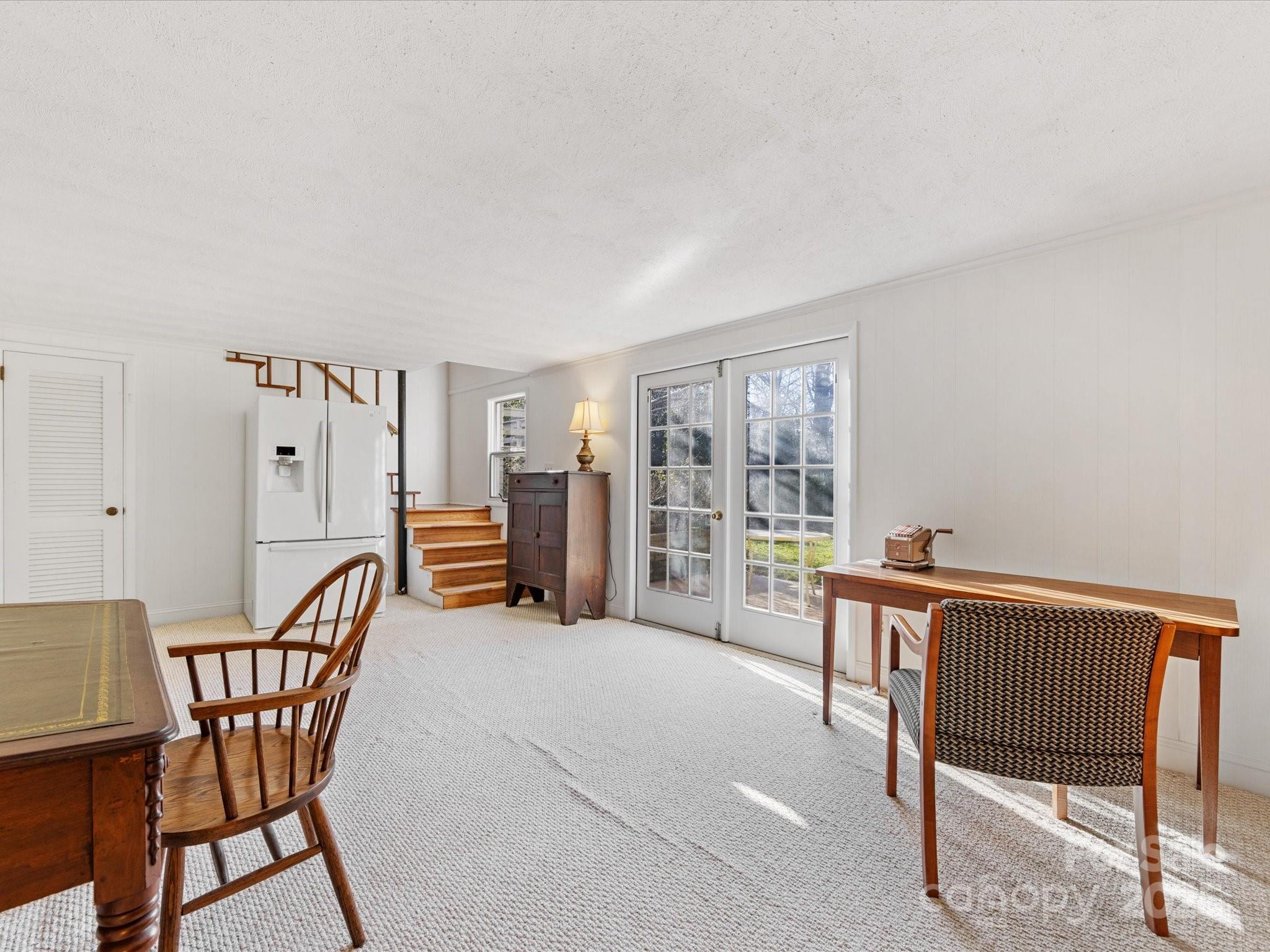 555 Manning Drive, Unit 7 Charlotte, NC 28209 - Photo 37 of 45 a bedroom with furniture and a window