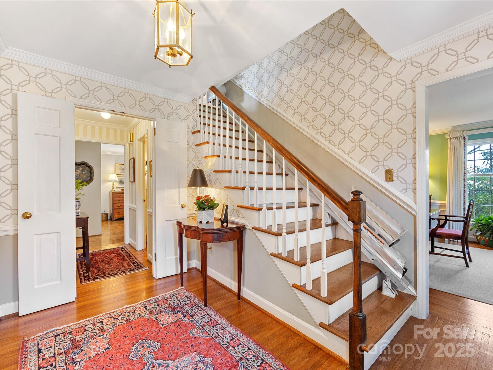 555 Manning Drive, Unit 7 Charlotte, NC 28209 - Photo 4 of 45 a view of entryway livingroom and hall with wooden floor