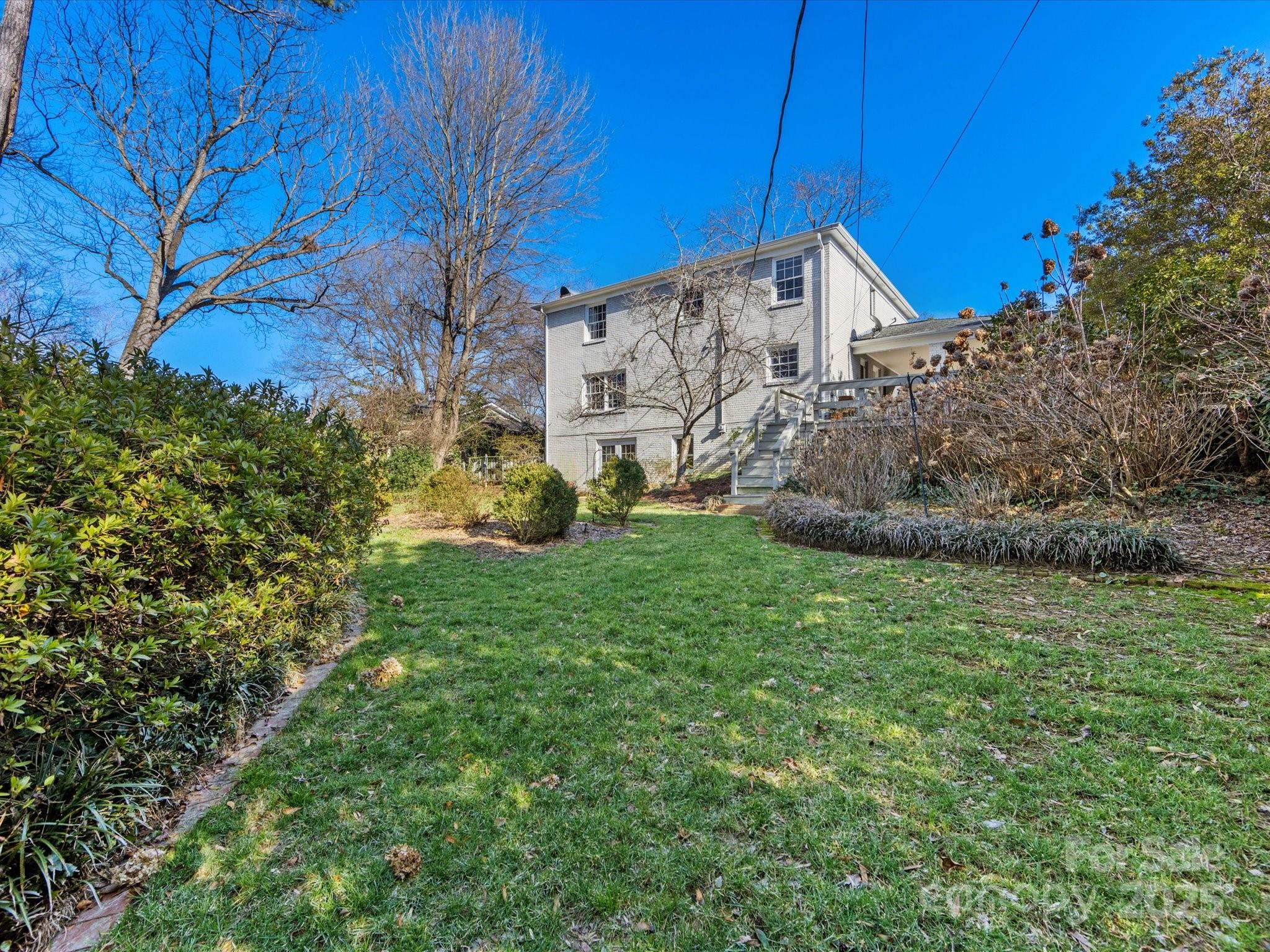555 Manning Drive, Unit 7 Charlotte, NC 28209 - Photo 41 of 45 a view of a backyard