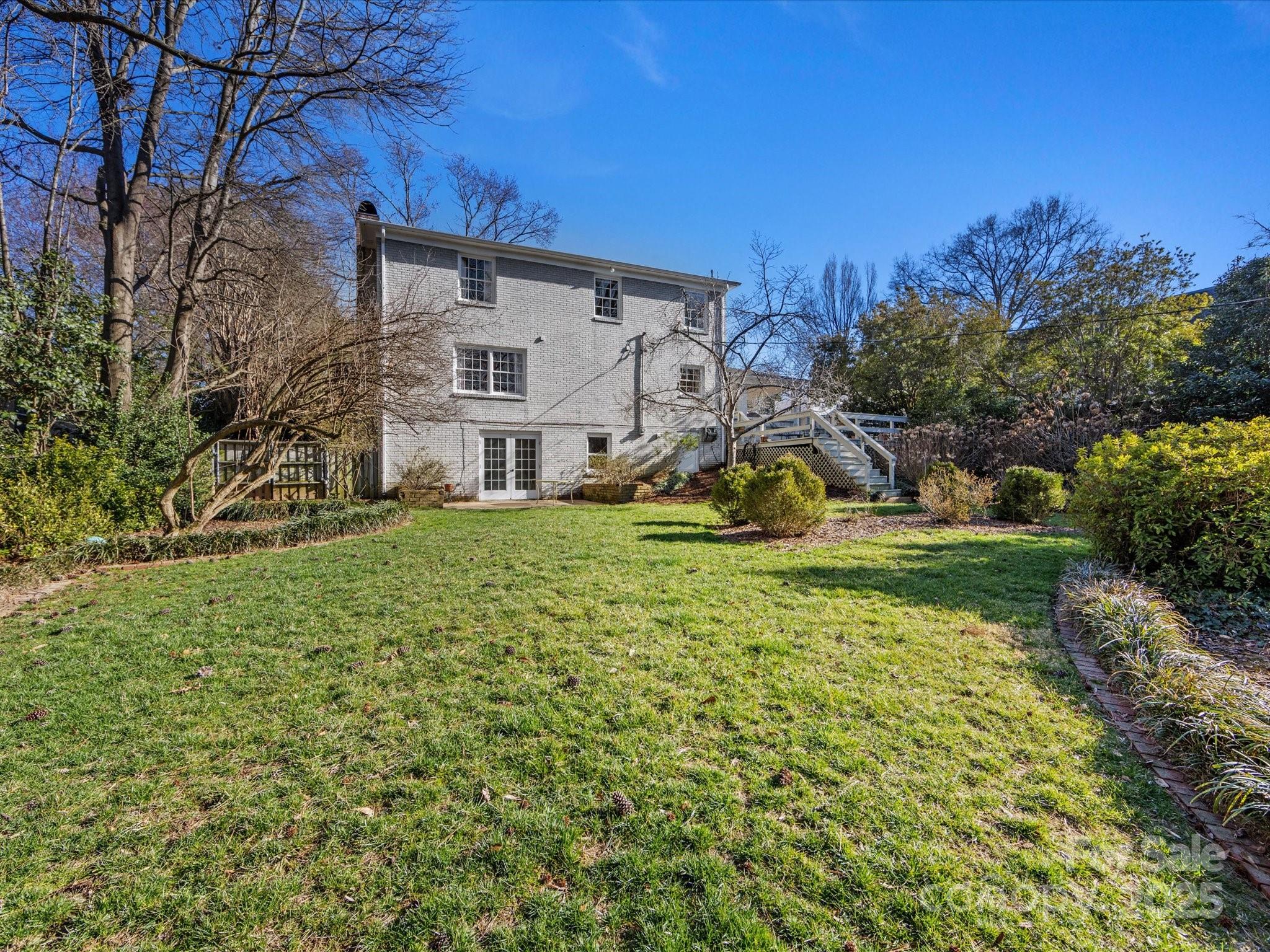 555 Manning Drive, Unit 7 Charlotte, NC 28209 - Photo 42 of 45 a view of a house with a big yard