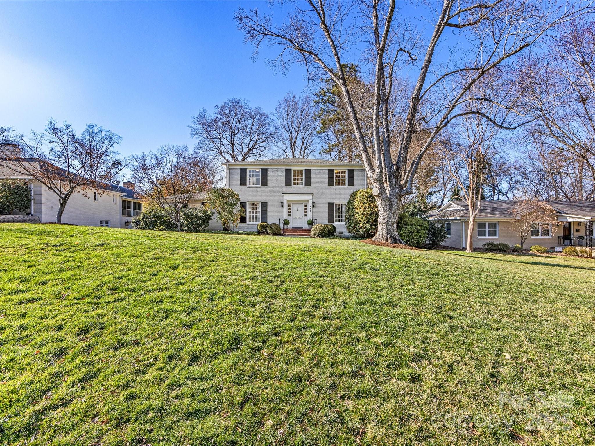 555 Manning Drive, Unit 7 Charlotte, NC 28209 - Photo 45 of 45 a view of a house with a yard