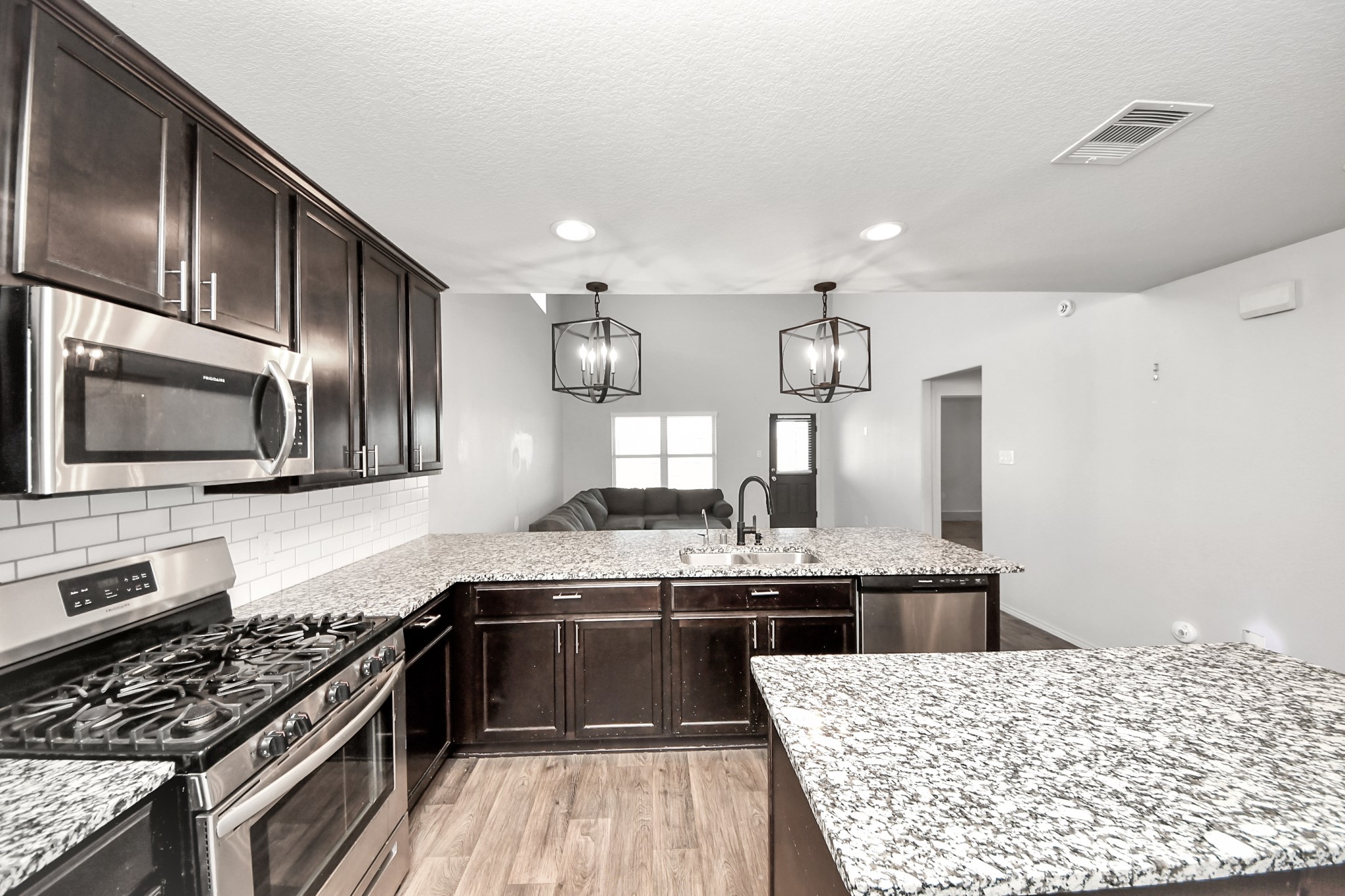 619 Ashley Falls Lane Rosharon, TX 77583 - Photo 13 of 31 The open sightlines create a seamless connection between the main living areas, making it easy to host guests while still feeling comfortable and connected
