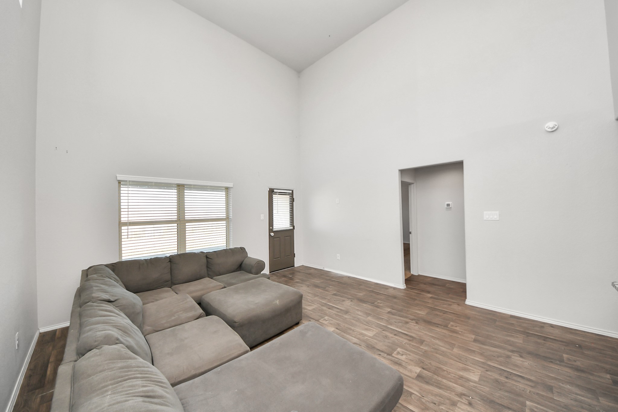 619 Ashley Falls Lane Rosharon, TX 77583 - Photo 14 of 31 The soaring ceilings and expansive living space create an airy, welcoming atmosphere ideal for gatherings or relaxing at home.