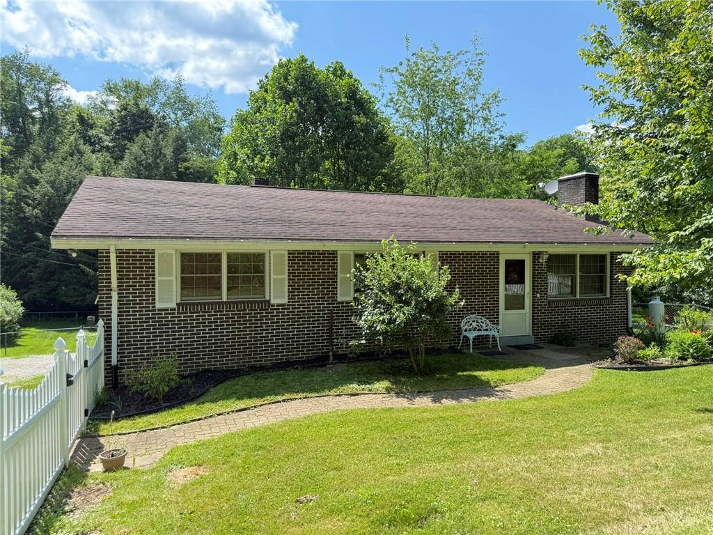 a view of a house with a garden
