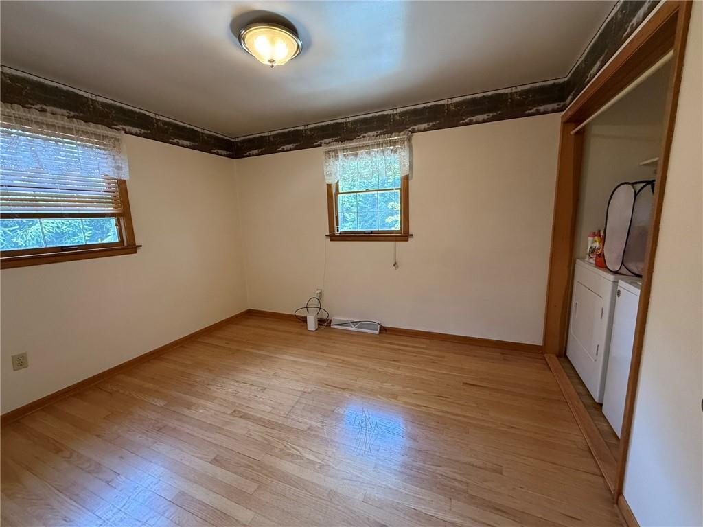960 Watt Road Apollo, PA 15613 - Photo 15 of 24 a view of an empty room with wooden floor and a window