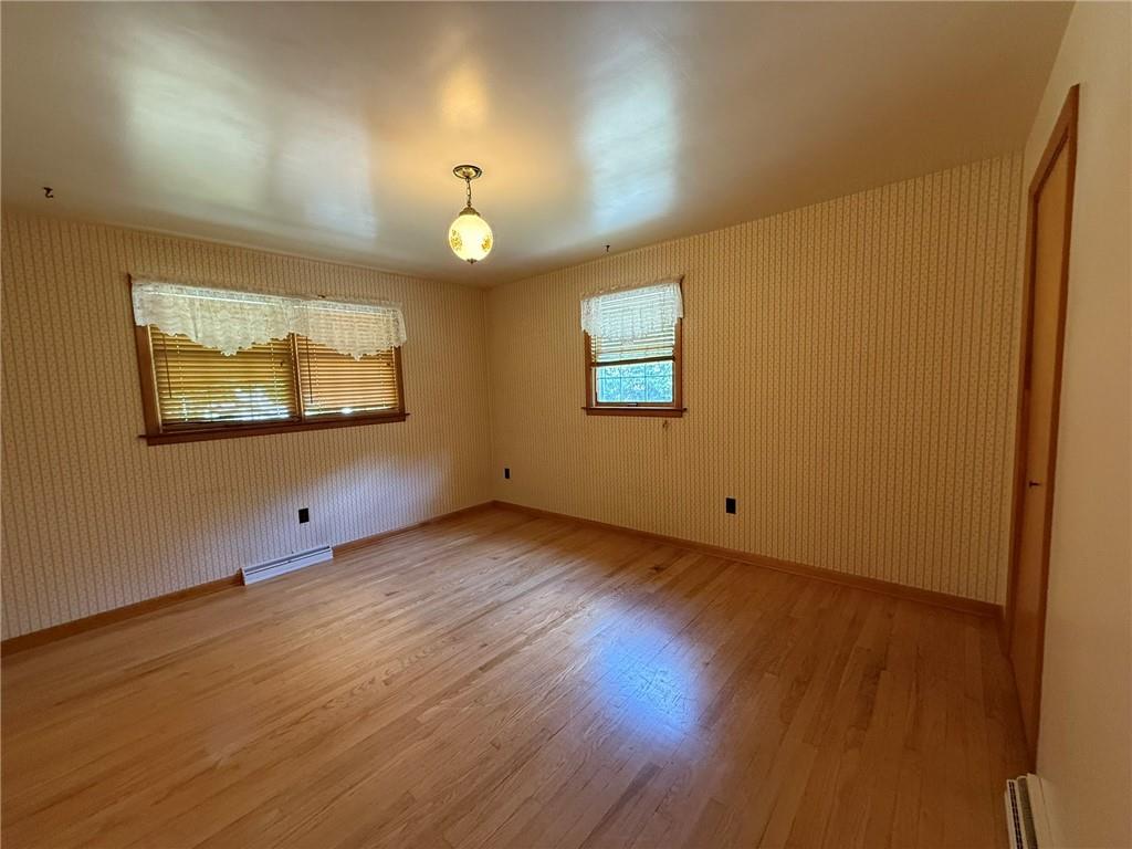 960 Watt Road Apollo, PA 15613 - Photo 16 of 24 a view of an empty room with wooden floor and a window