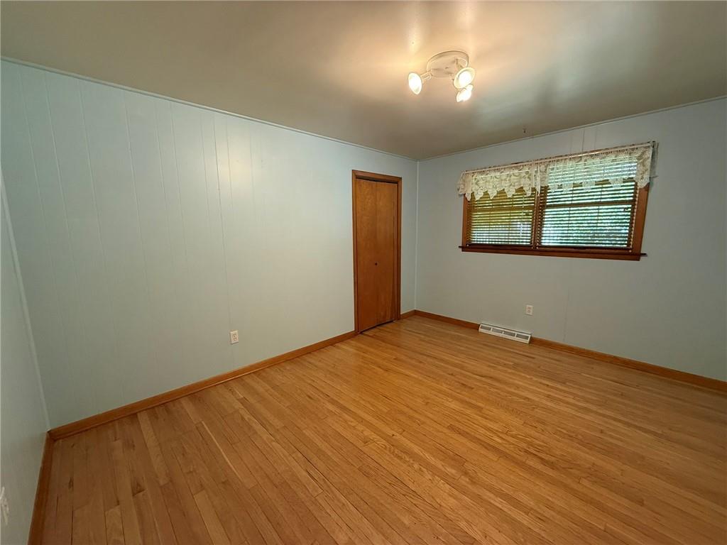 960 Watt Road Apollo, PA 15613 - Photo 17 of 24 an empty room with wooden floor and windows