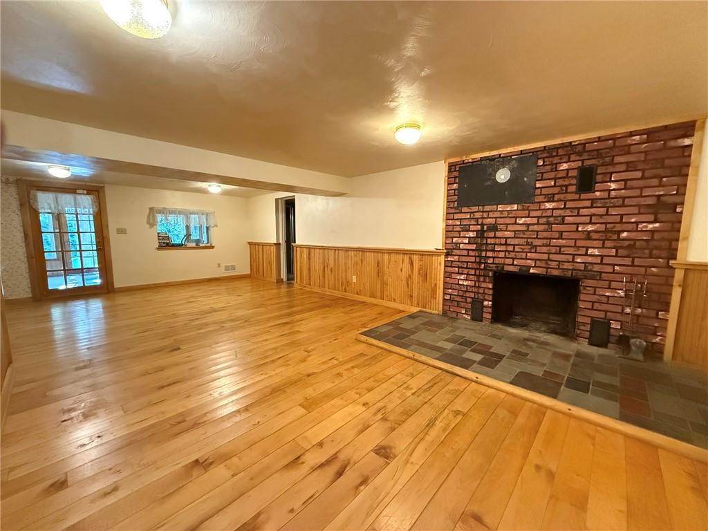 960 Watt Road Apollo, PA 15613 - Photo 18 of 24 a view of empty room with wooden floor and fireplace