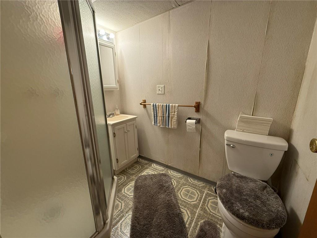 960 Watt Road Apollo, PA 15613 - Photo 20 of 24 a bathroom with a granite countertop toilet and a sink