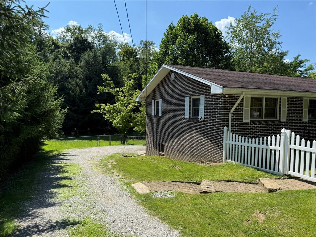 960 Watt Road Apollo, PA 15613 - Photo 4 of 24 a view of a backyard with a small cabin