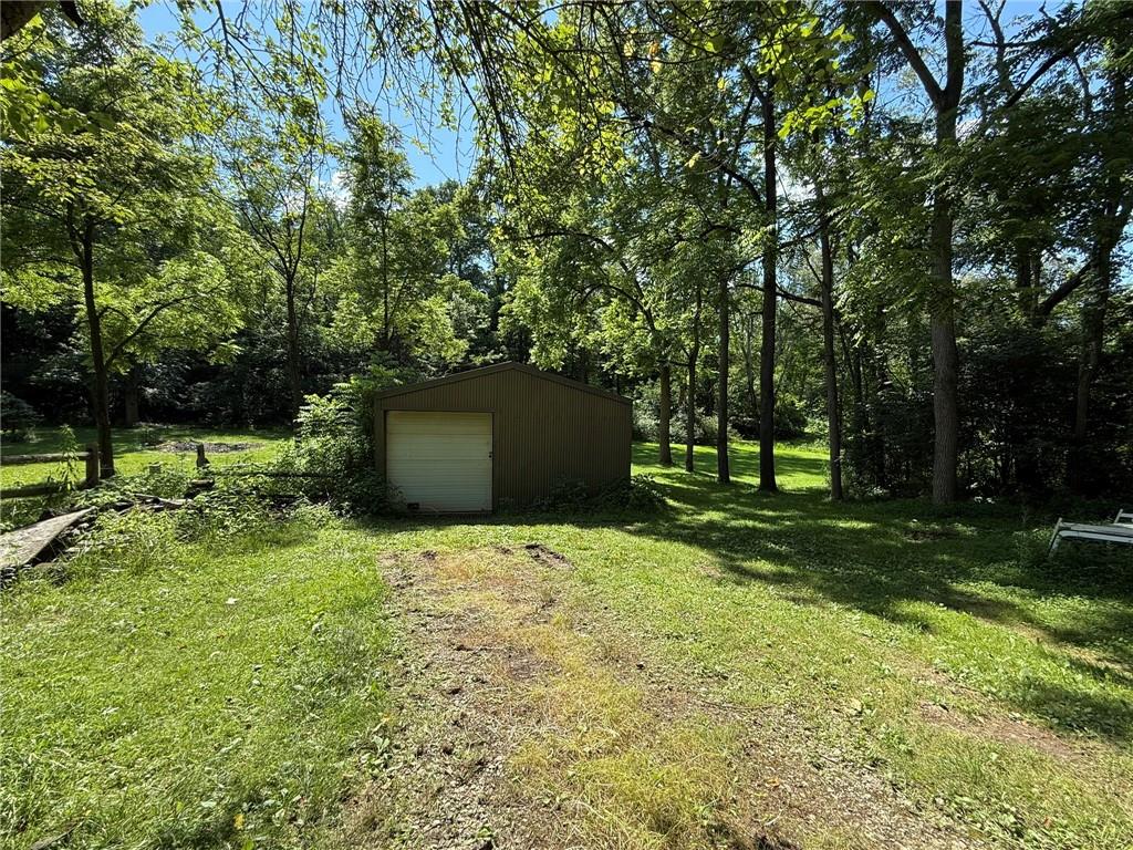 960 Watt Road Apollo, PA 15613 - Photo 9 of 24 a backyard of a house with plants and large trees