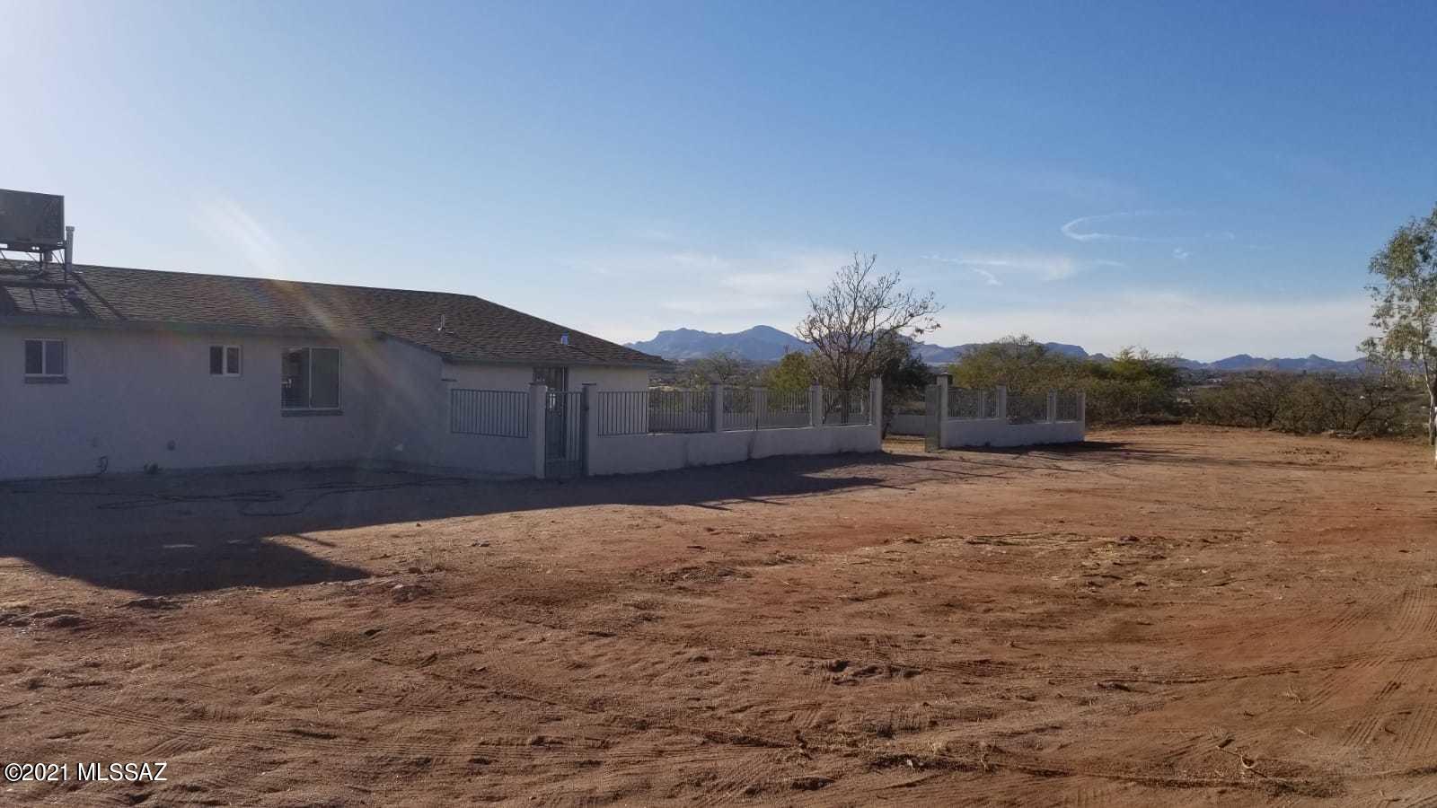 897 Via Savalza Rio Rico, AZ 85648 - Photo 9 of 27 a backyard of a house