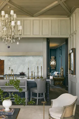 a kitchen with stainless steel appliances kitchen island granite countertop a sink and cabinets