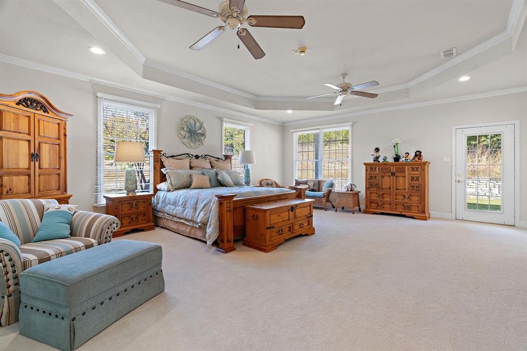 72 Crown Road Willow Park, TX 76087 - Photo 22 of 40 a spacious bedroom with a bed and window