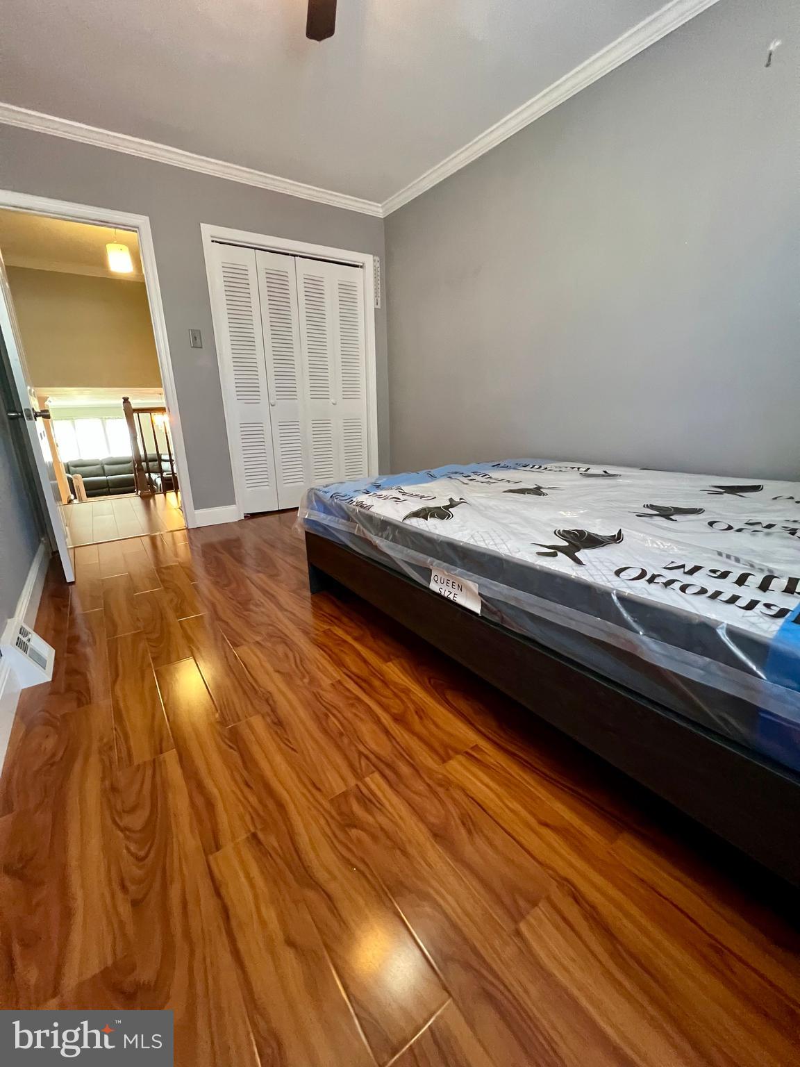 2988 Welsh Road Philadelphia, PA 19152 - Photo 29 of 38 a bedroom with a bed and wooden floor