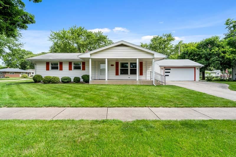4702 Mohawk Road Rockford, IL 61107 - Photo 1 of 41 a front view of a house with a garden