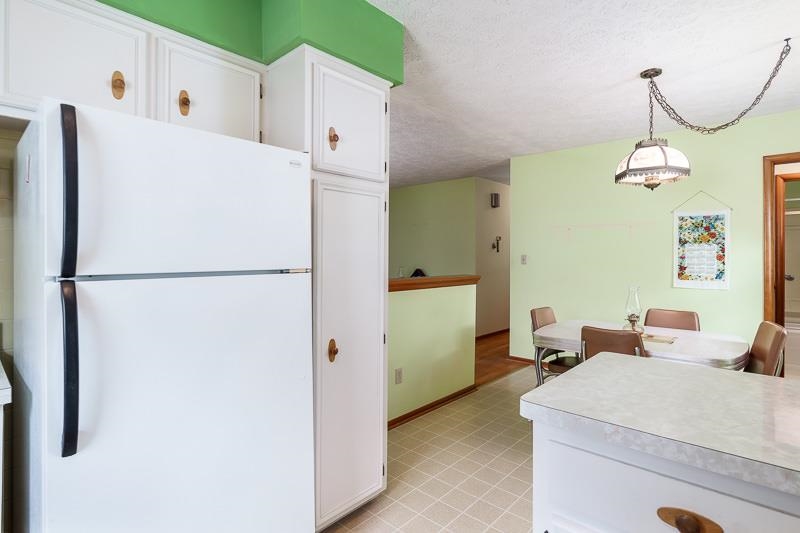 4702 Mohawk Road Rockford, IL 61107 - Photo 15 of 41 a white refrigerator freezer sitting next to a white wall