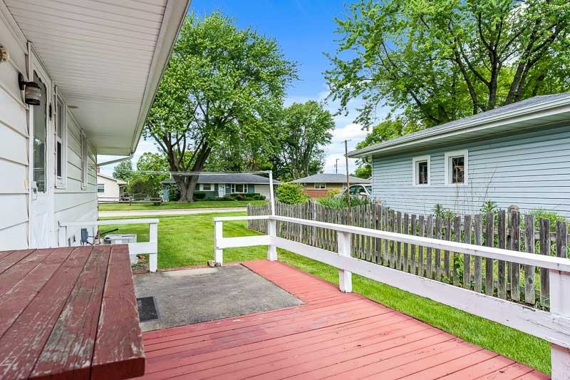 4702 Mohawk Road Rockford, IL 61107 - Photo 30 of 41 a view of house with deck and outdoor seating