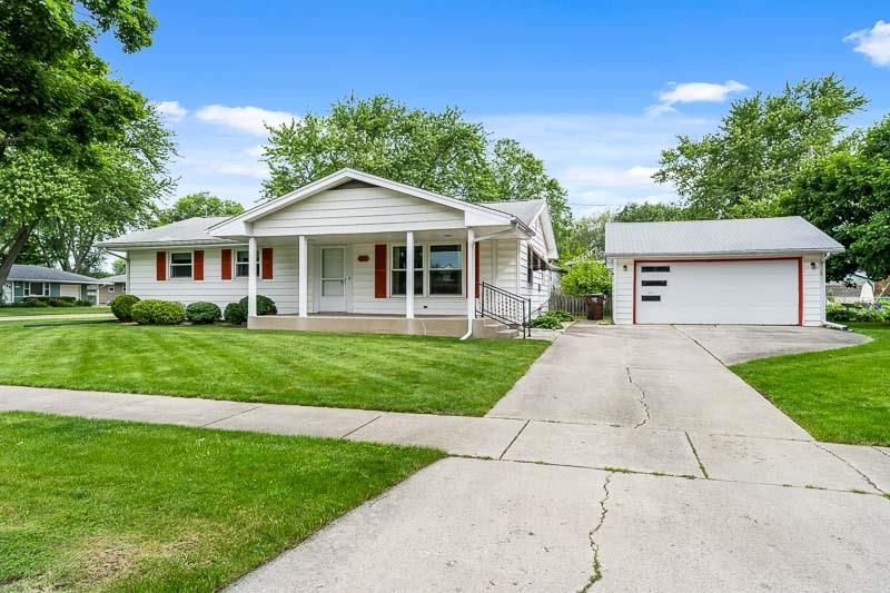 4702 Mohawk Road Rockford, IL 61107 - Photo 3 of 41 a front view of a house with a yard and trees