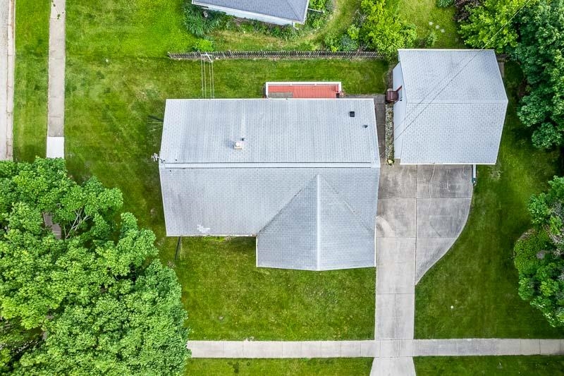4702 Mohawk Road Rockford, IL 61107 - Photo 39 of 41 an aerial view of a house with a garden and a yard