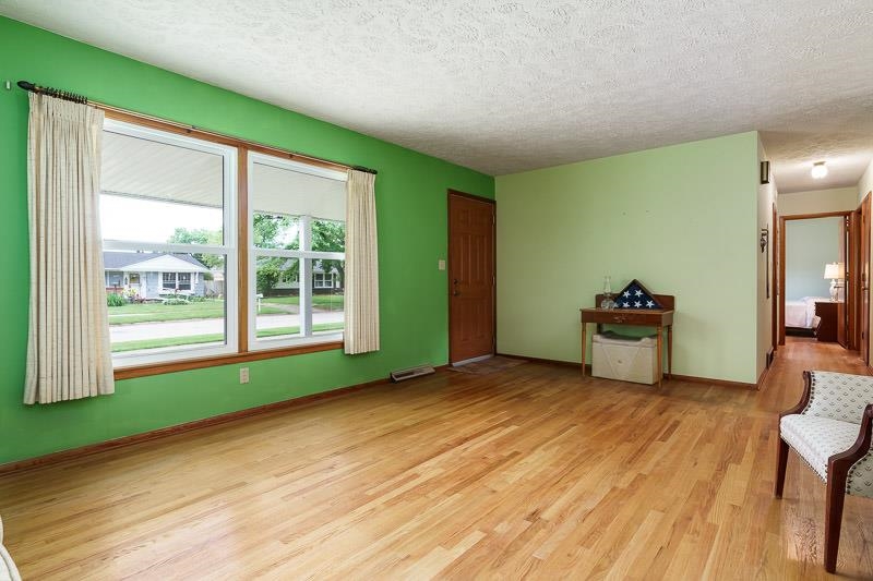 4702 Mohawk Road Rockford, IL 61107 - Photo 8 of 41 a view of an empty room with glass door and a window