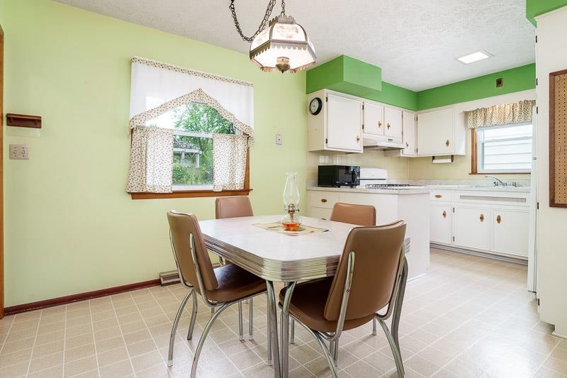 4702 Mohawk Road Rockford, IL 61107 - Photo 10 of 41 a view of a dining room with furniture window and outside view