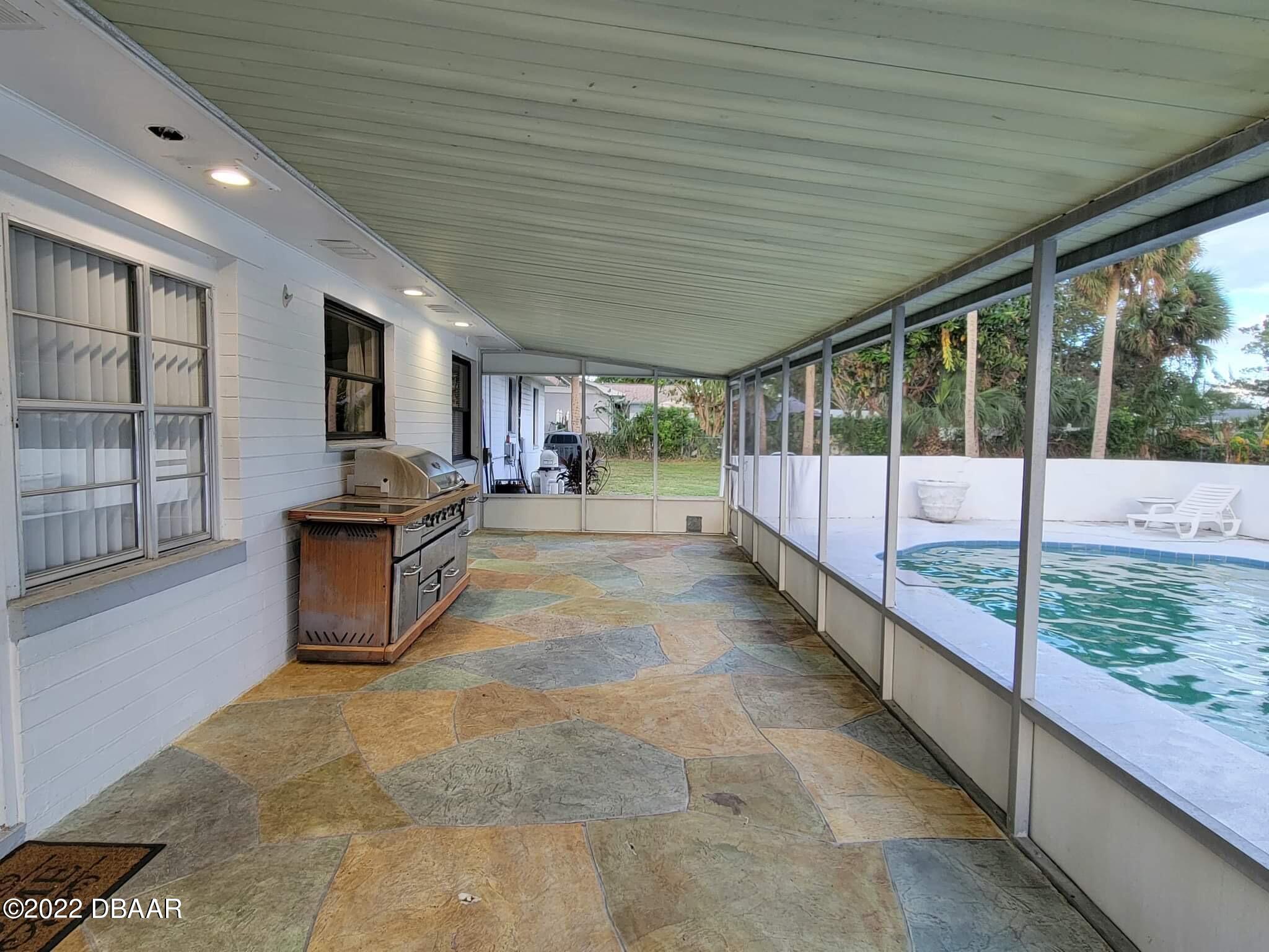 519 Big Tree Road South Daytona, FL 32119 - Photo 22 of 28 Back porch/pool area