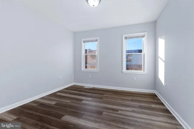 a view of room with window and hardwood floor
